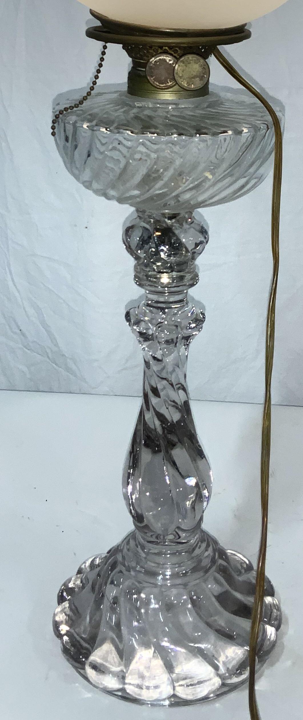 BACCARAT Retrofitted Vintage Glass Lamp: Gone with the wing style shades glass lamp shade, pull chain , use on/ off switch on cord. Appears to have been an oil lamp up cycled to contemporary lighting. Heavy embossed glass with a hint of pink