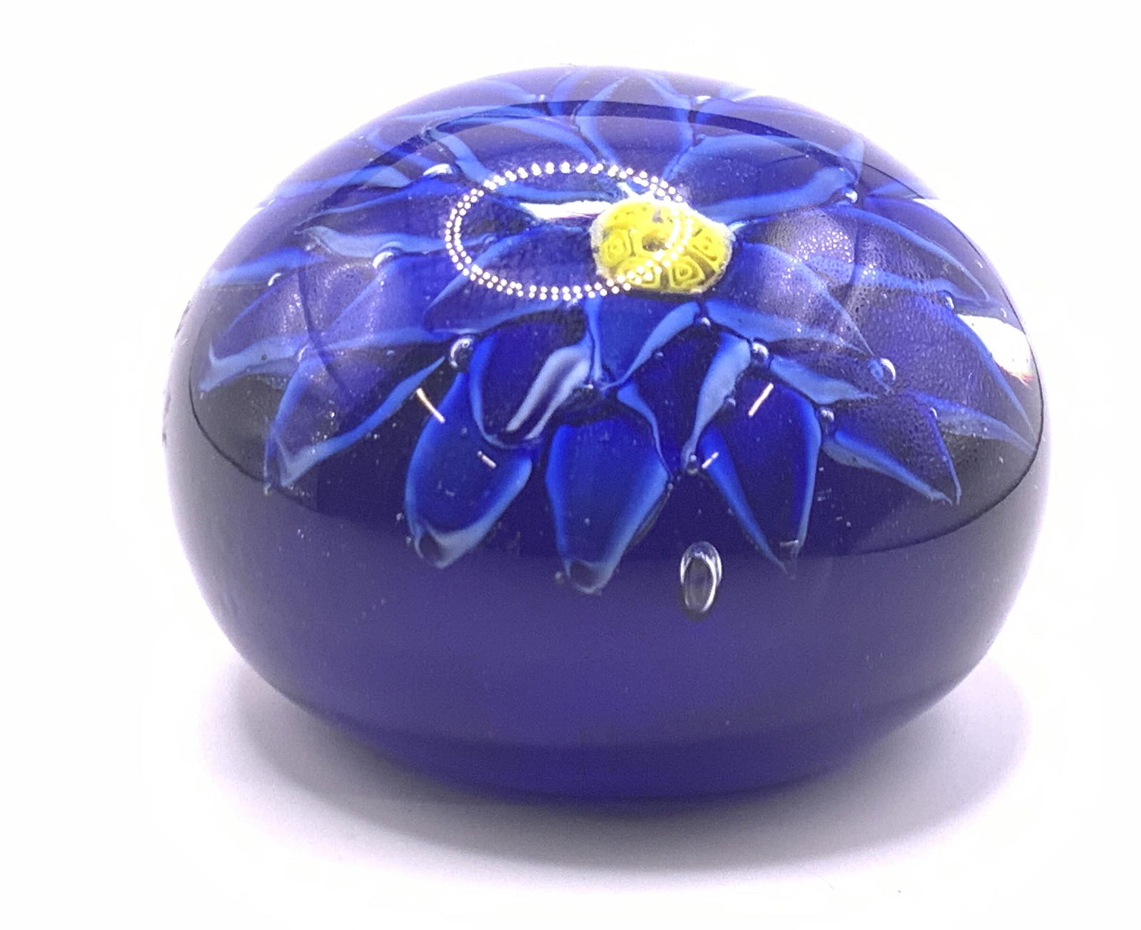 Vintage Floral Art Glass Paperweight: A vintage floral art glass paperweight. Rich cobalt blue and yellow hues. Measures approx 2H x 3W in. Some surface wear consistent with use and age. Bubbles present. Some sticker residue to piece. Vin