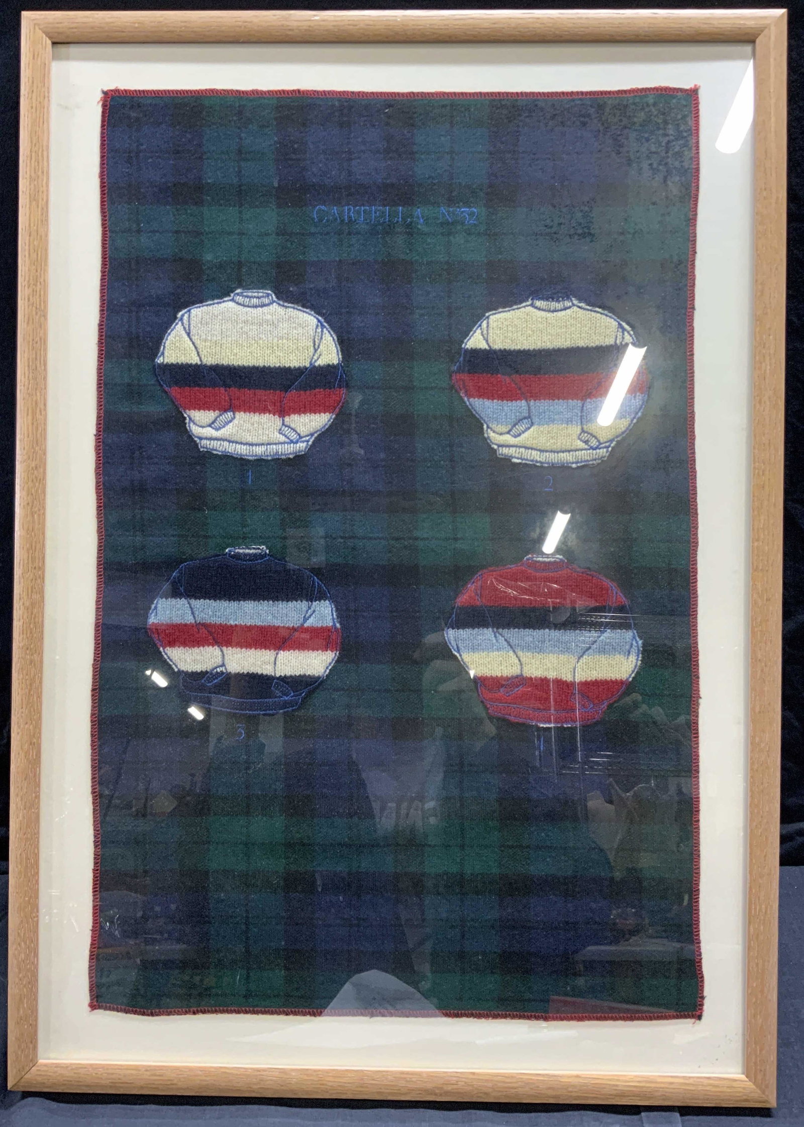 CARTELLA N 32 Framed Italian Applique Sweater Samp: CARTELLA N 32 Framed Italian Applique Sweater Samples, CARTELLA N 32 embroidered to top center, four sweater pattern samples Collaged with numbers 1-4 embroidered below, frame measures 19 x 27 inches,