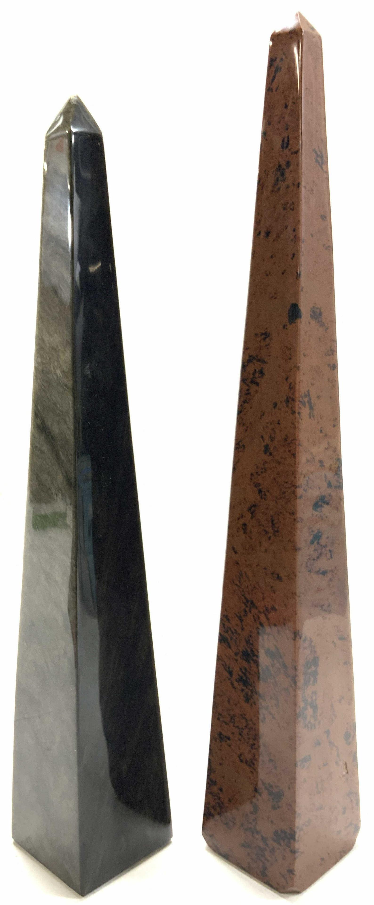 Golden Obsidian & Mahogany Obsidian Obelisks: Set of 2 natural stone obelisks. 1 possibly made of polished Mahogany obsidian (14.25 inches tall) and 1 made of polished golden obsidian (13 inches tall) corners of mahogany obelisk are cut up on bas