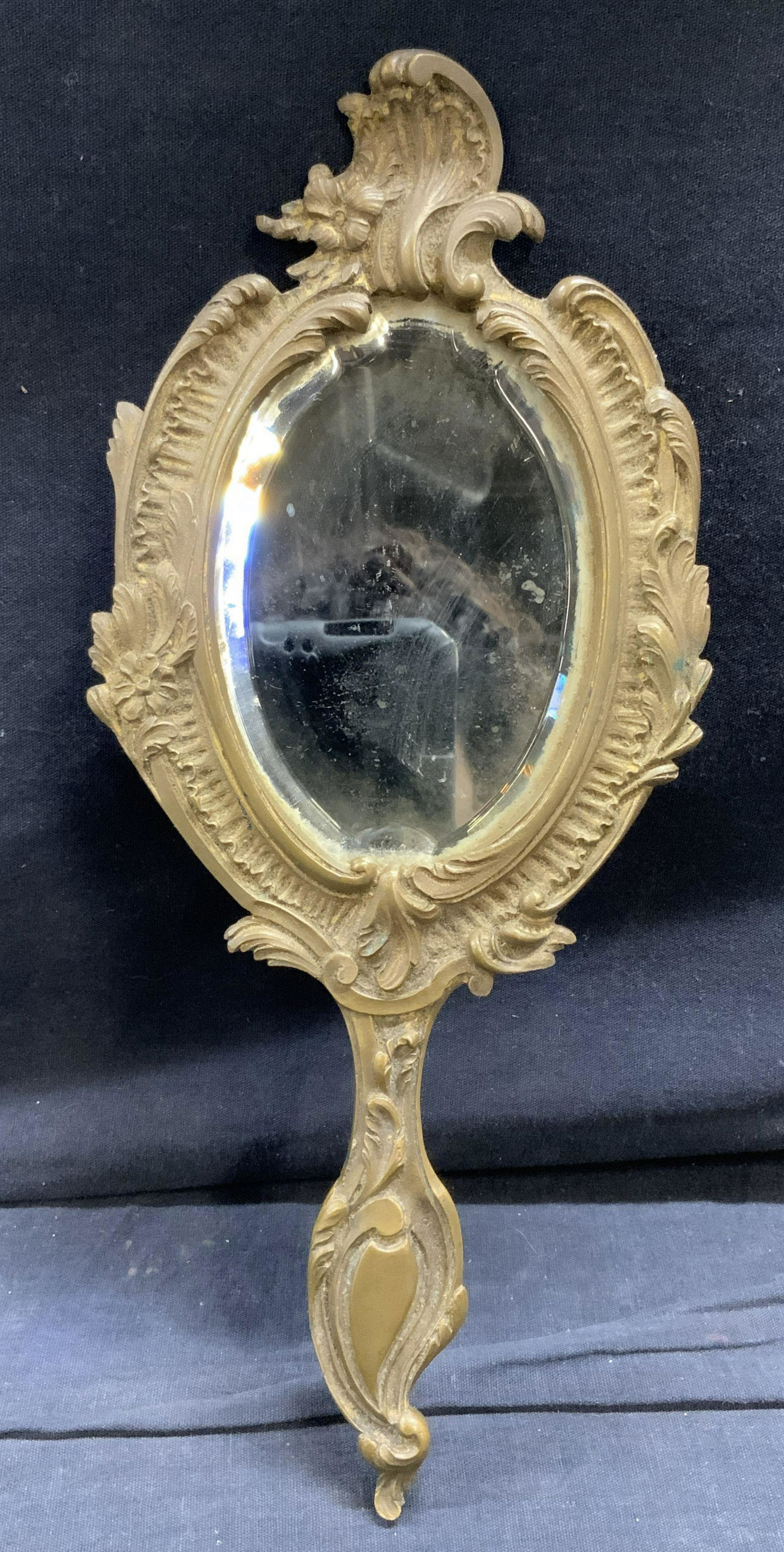 Antique Hand Held Mirror: Antique Hand Held Mirror, possibly bronze, measures 5 1/2 inches wide x 11 1/2 inches tall. Property of Greenwich, CT Estate. Hand held mirror, antique mirrors, hand held mirror, antiques, antique bed