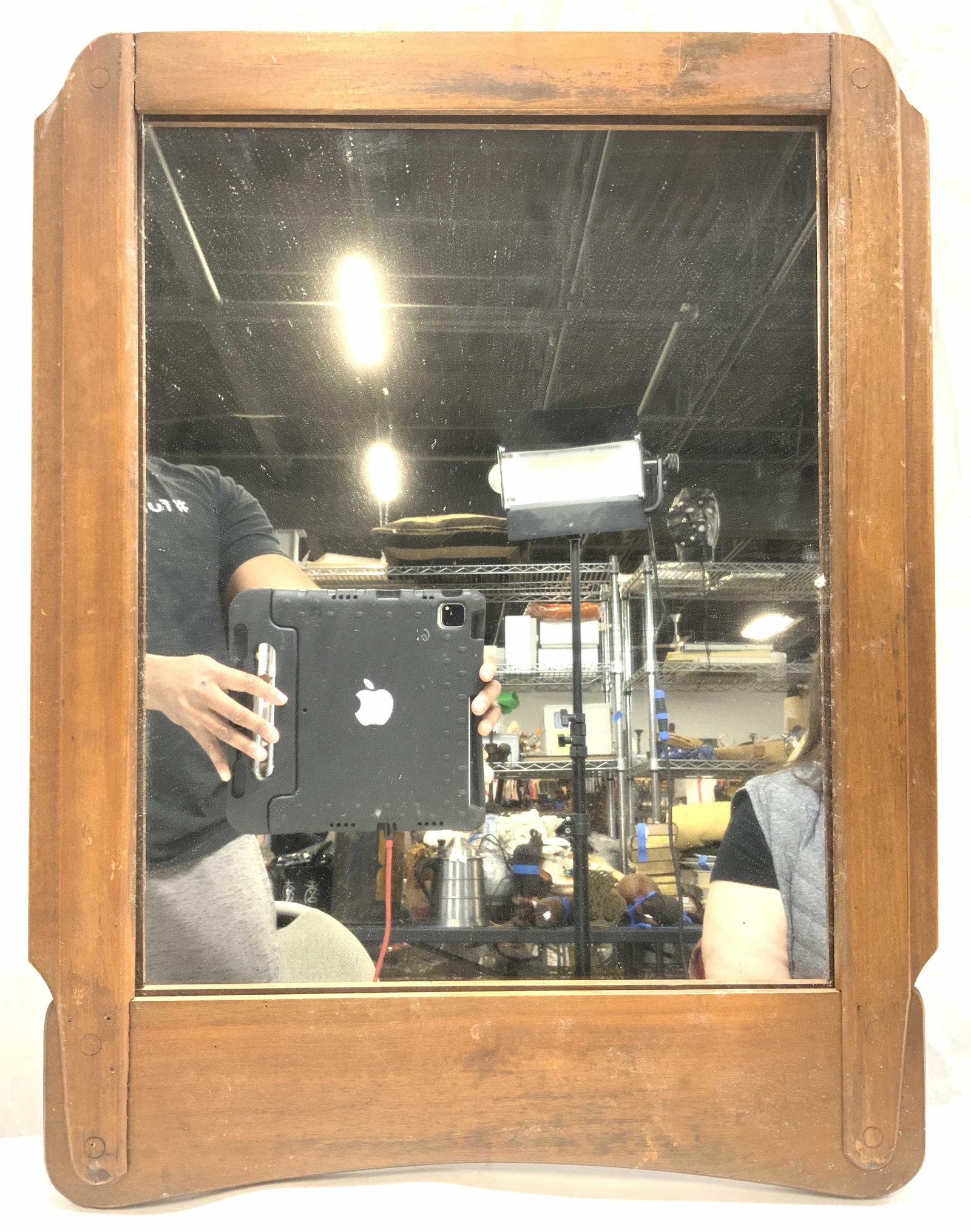 Vintage Carved Wood Frame Mirror: Mirror is vintage with light brown toned toned wooden frame. Frame appears to possibly be hand crafted. Piece measures approx 25 inches tall 20 inches wide. Mirror, wall mirror, vintage mirror, wall d