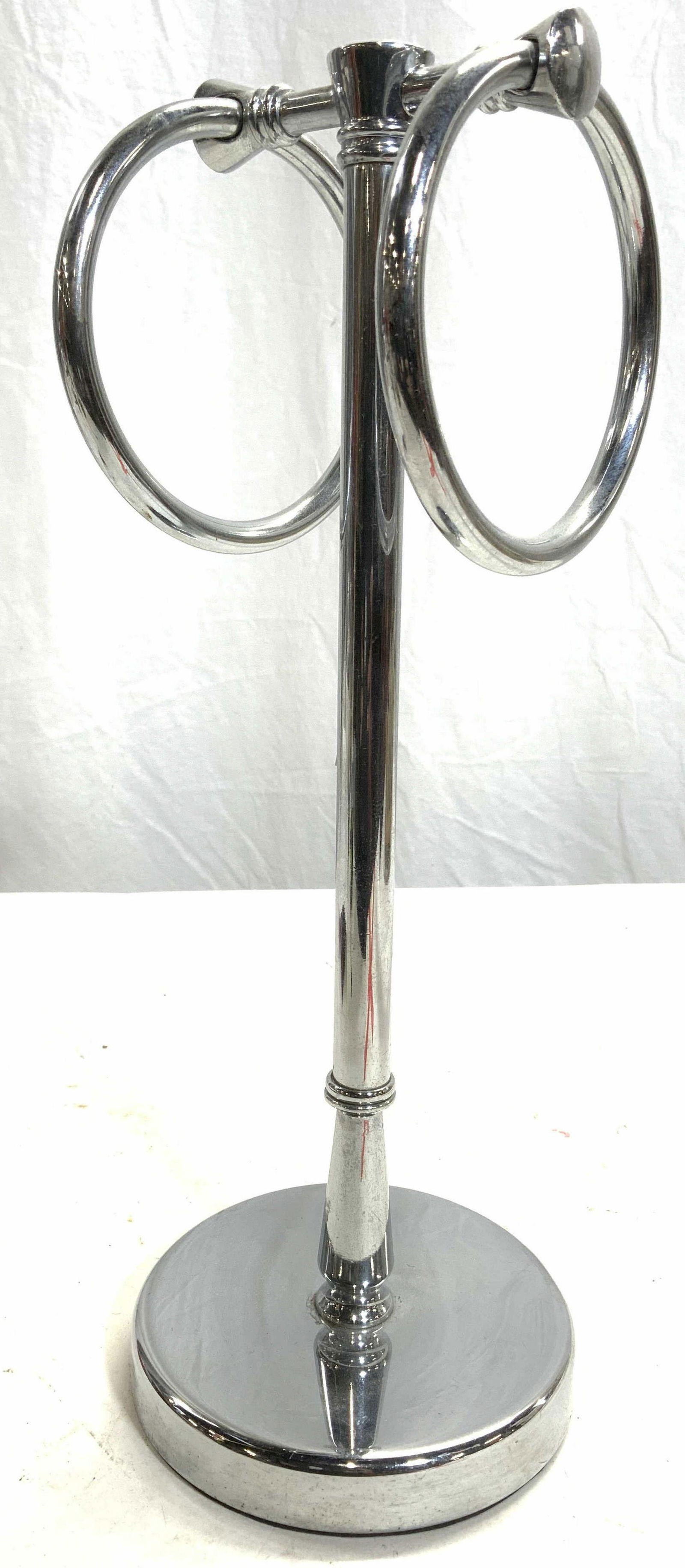 Metal Double Ring Hand Towel Holder: Hand towel holder is metal. Piece has double ring structure & circular shaped base. Piece measures approx 14 inches tall 4.25 inches wide & deep. Hand towel holder, metal hand towel holder, double rin