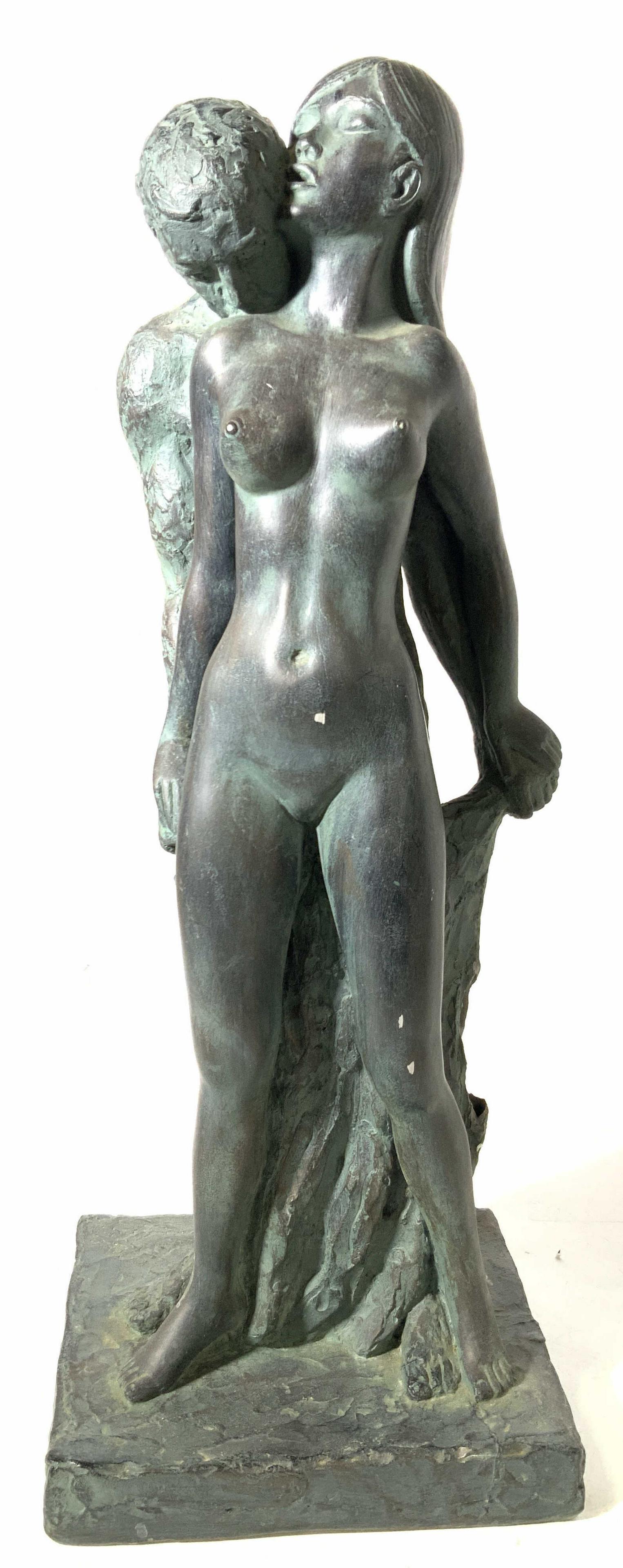 SIGNED Bronze Coated Nude Couple Embracing: Signed on base Leonardo Art Works Inc. on base, this sculpture depicts a nude woman being embraced by a nude male figure on a square base. Made of plaster and coated in bronze. Approximately 20 inches