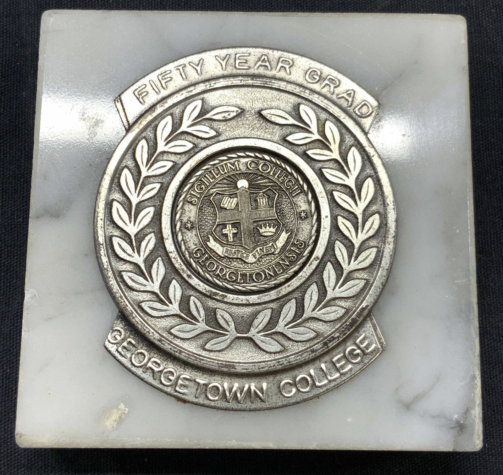 VNTG George Town College Fifty Year Grad Medal: Vintage George Town college medal on a natural stone square. Medal is silver toned, possibly made of pewter and reads Fifty Year Grad, George Town College. In center reads Sigillum Collecii, Georgeton