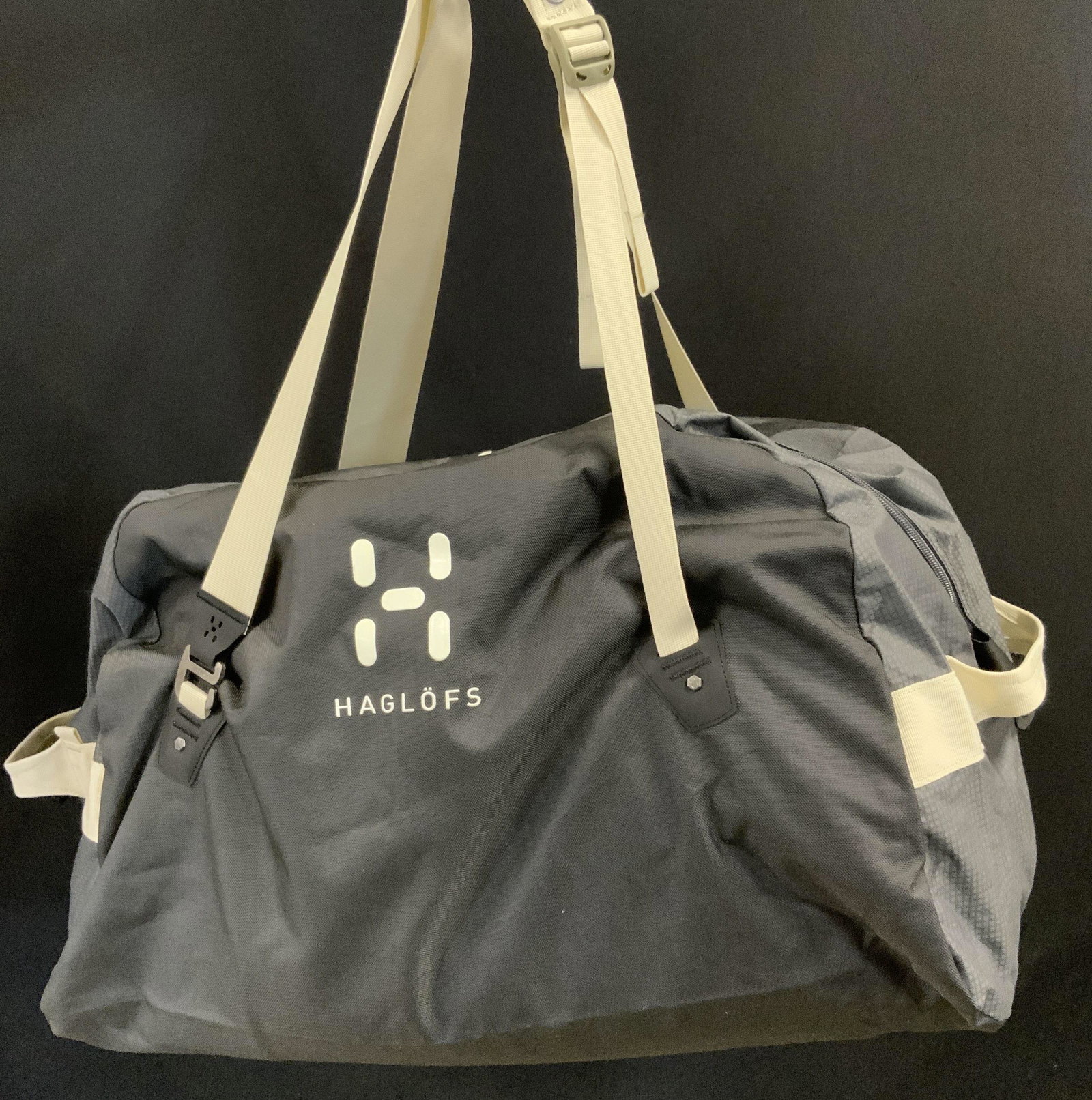 HAGLOFS Duffel Dome 70 Bag: HAGLOFS Duffel Bag, likely made from 100% Recycled Polyester, measures approx 34 inches long x 15 inches wide x 12 inches tall. Property of Adam Sandberg, Manhattan Estate. HAGLOFS, OUTERWEAR, Luxury
