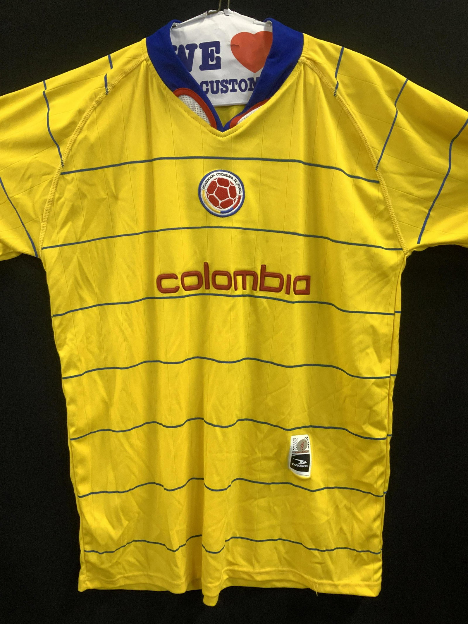 DRAKO COLOMBIA FEDERATION Soccer Shirt: Official Federacion Colombiana de Futbol Soccer shirt, Manufactured by DRAKO. Lightweight fabric, yellow with blue horizontal stripes, red, white and blue collar with sweat wicking mesh fabric . Short