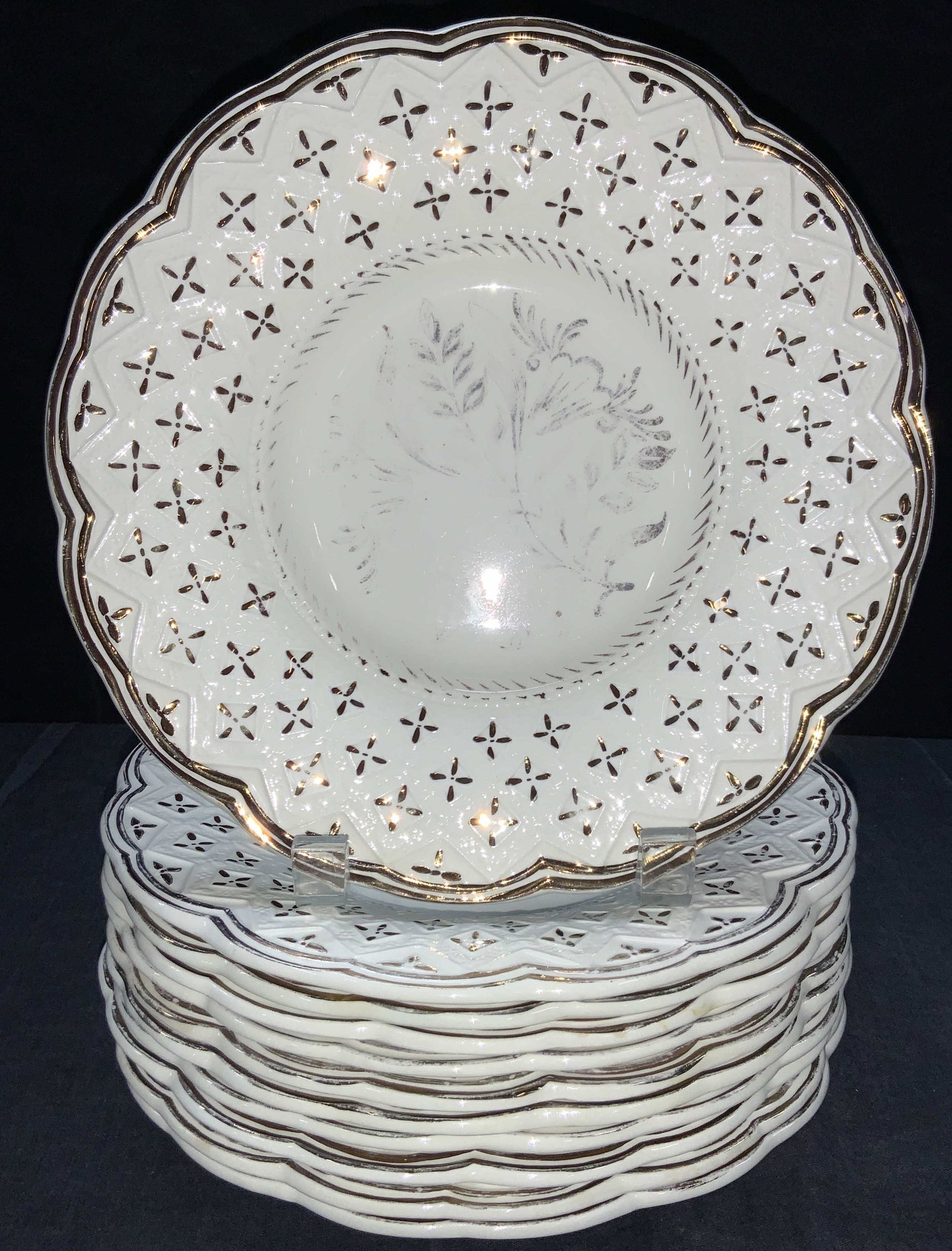 Set 11 WEDGWOOD Ornate Porcelain Plates: Set of 11 Porcelain plates with flower forms with gilt on rims and accents on center. Marked on undersides Wedgwood Of Etruria & Barlaston, made in England. Approximately 9 inch diameter. Gilt is wear