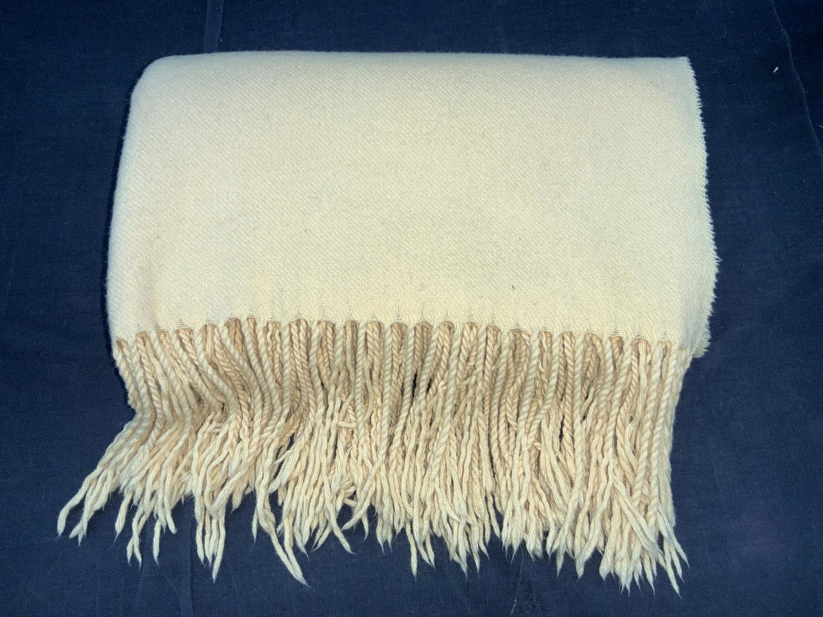 PUR CASHMERE Cashmere Yellow Toned Blanket: A yellow toned fringed blanket, marked on tag Pur Cashmere. Soft hand. Approximately 48 inches wide and 60 inches long. Fringe is approximately 5 inches long. Property of Manhattan, NY Estate. Some su
