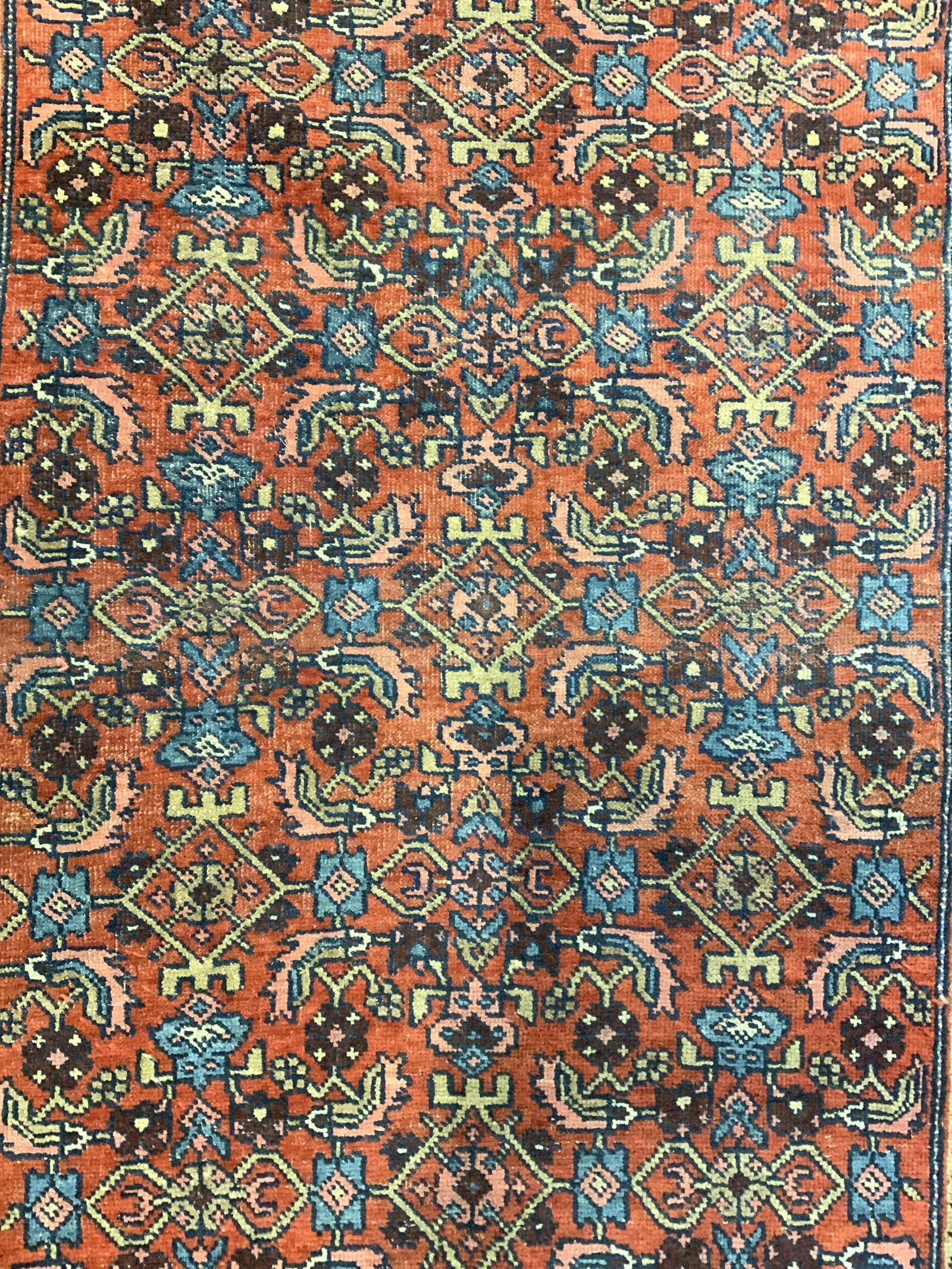 Vintage Handmade Persian Wool Rug: Rug is handmade and wool. Piece is vintage possibly antique. Rug has intricate multi toned floral, leaf, & geometric detail. Rug measures approx 47 inches long 32 inches wide. Rug, carpet, wool rug, h