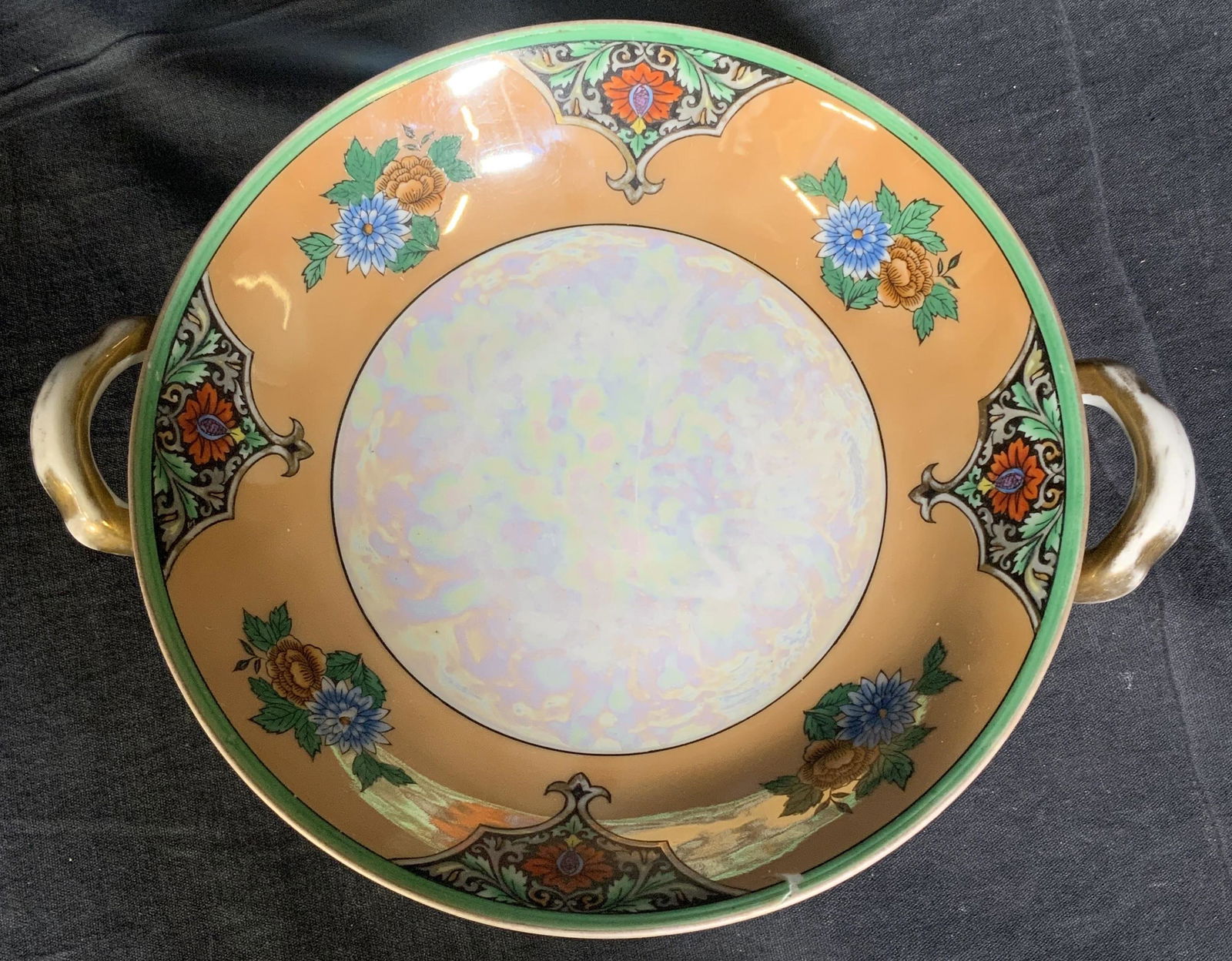 NORITAKE Hand Painted Footed Bowl, Japan: NORITAKE Hand Painted Footed Bowl, Japan, Underside reads NORITAKE HAND PAINTED MADE IN JAPAN, measures 10 inches wide x 2 1/2 inches tall. Chipping to rim. Property of a Manhattan, NY State. Porcelai