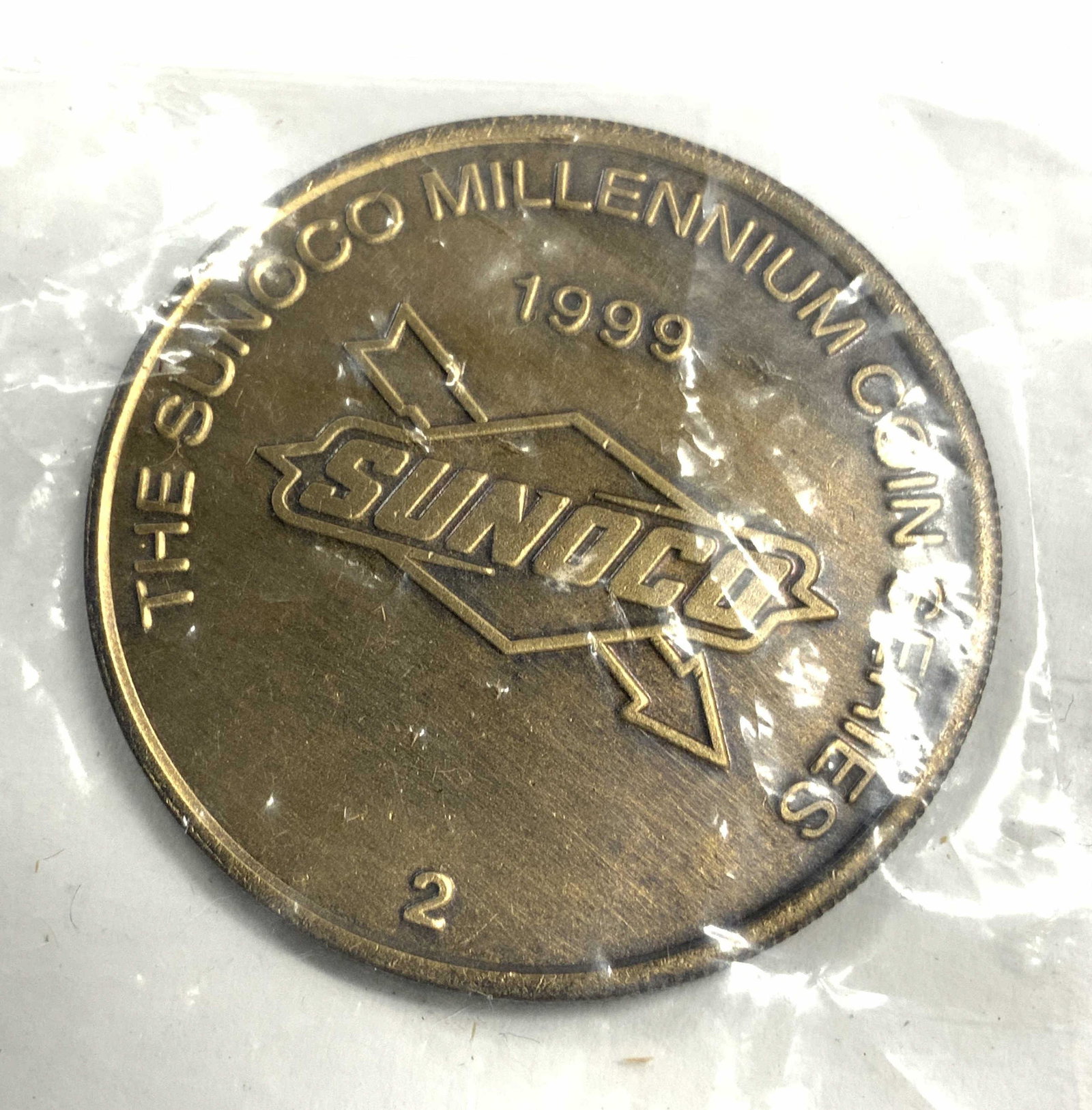 Lot 16 SUNOCO MILLENNIUM SERIES Coins: Lot includes 16 coins. Each are gold toned & metal, possibly brass. Coins read THE SUNOCO MILLENNIUM COIN SERIES. Backsides reads DECLARATION OF INDEPENDENCE. EACH Measures approx 1.25 inches wide,. C