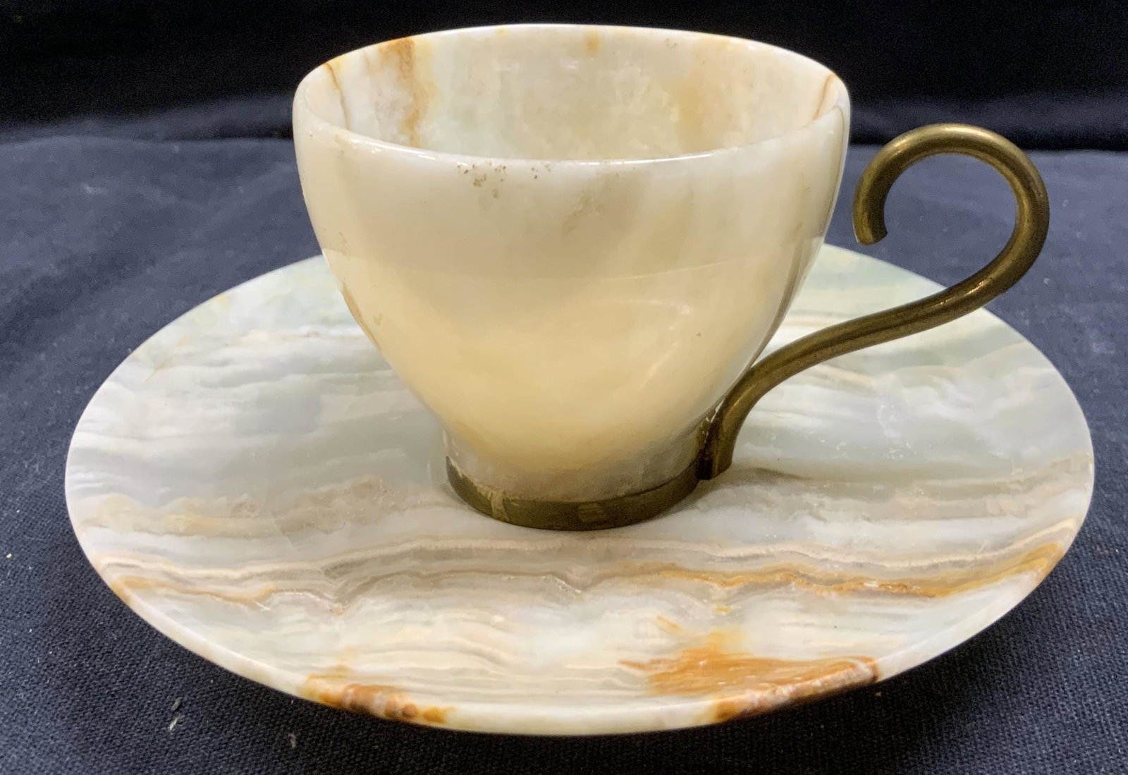 Alabaster Demitasse Teacup & Saucer: Alabaster Demitasse Teacup & Saucer, saucer measures 4 1/2 inches wide and teacup measures 3 3/8 inches wide x 2 inches tall. Alabaster, alabaster demitasse, alabaster teacup, alabaster homeware. Alab