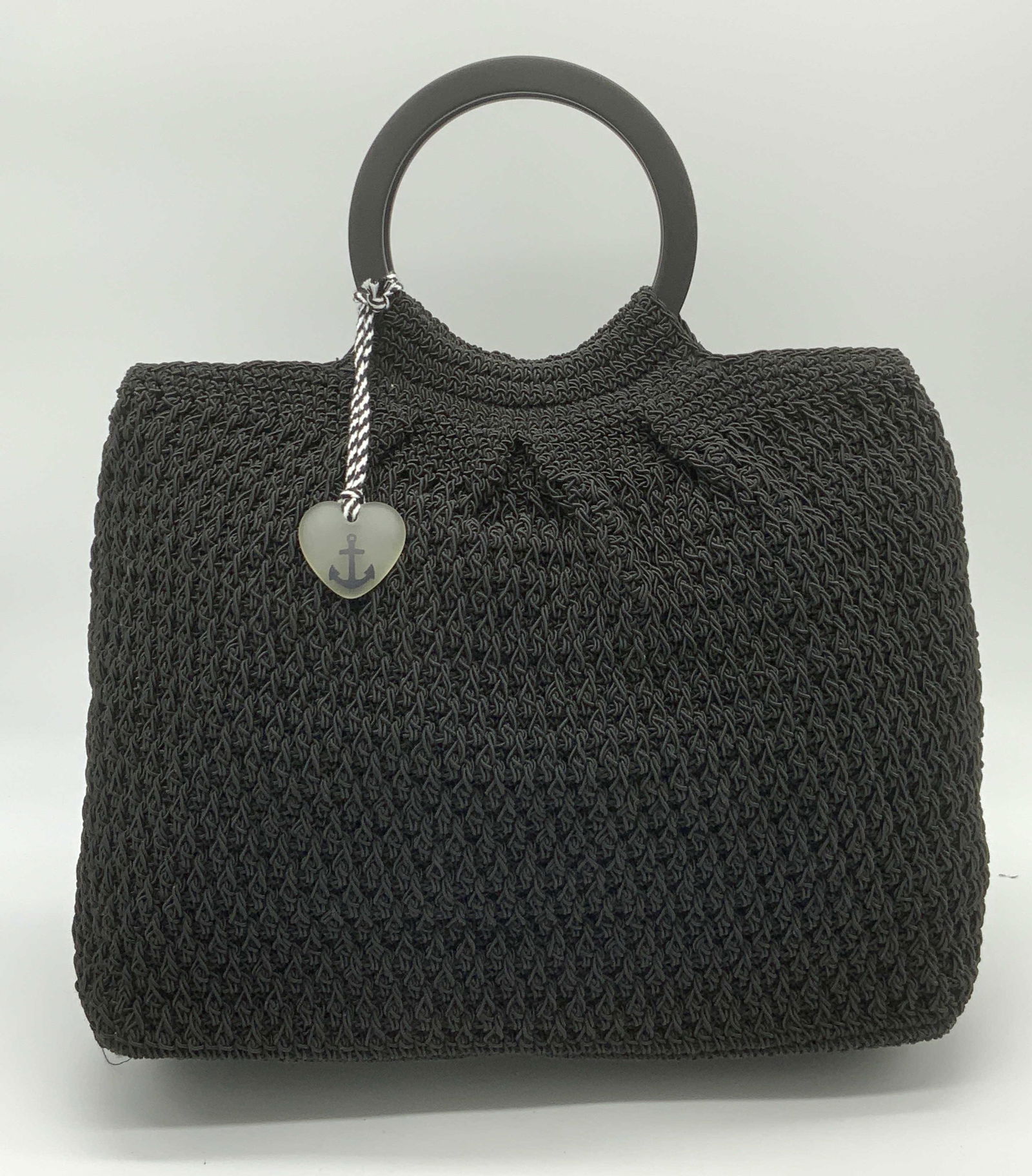 LIZ CLAIBORNE Nautical Motif Woven Handbag: LIZ CLAIBORNE Nautical Motif Woven Handbag, woven black nylon like material exterior, some surface wear to exterior, dual top circle handles, magnetic snap closure, anchor heart token keychain, interi