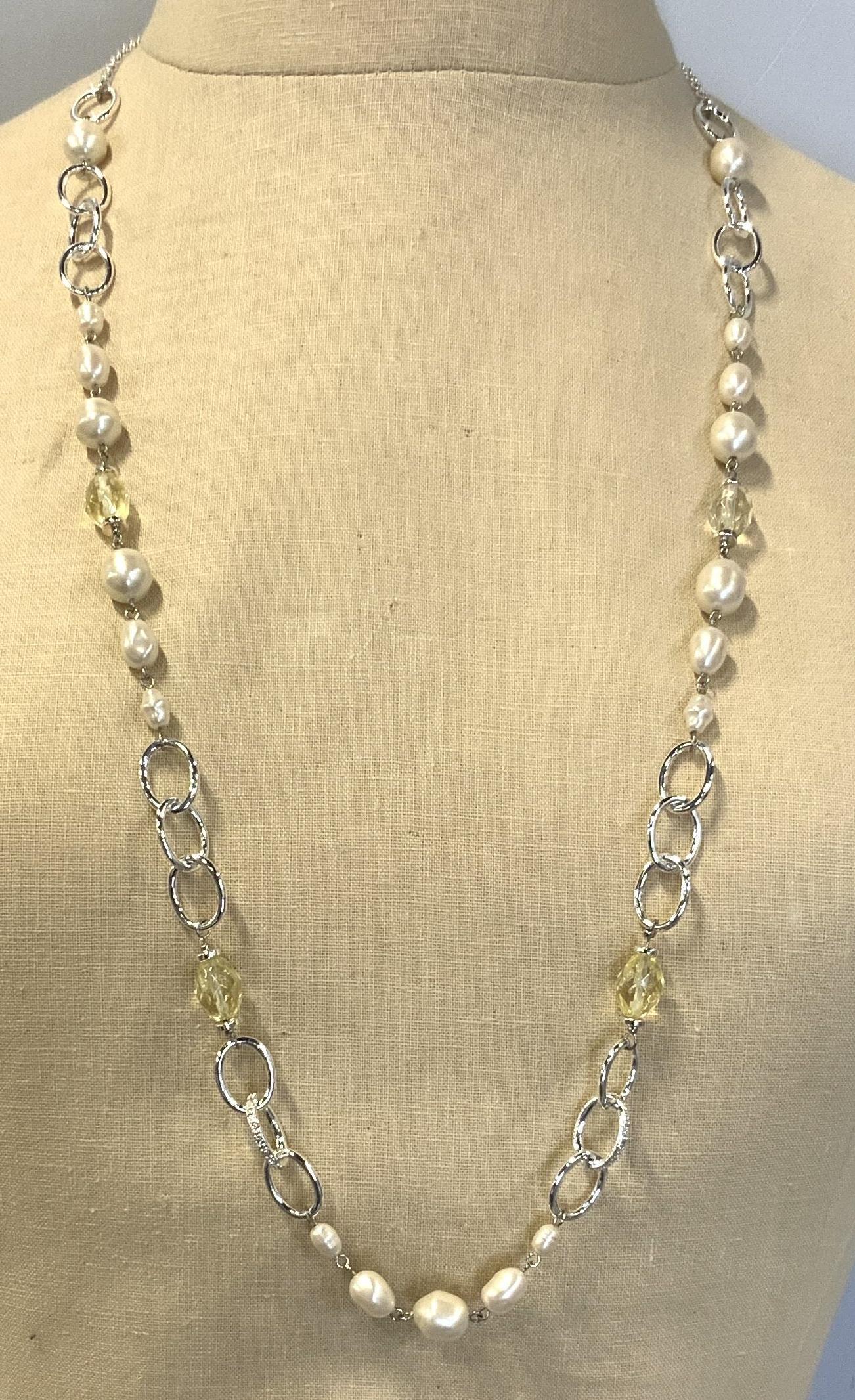 Pearlescent & Crystalline Beaded Necklace: Pearlescent & Crystalline Beaded Necklace, unique shaped pearlescent beads, with light green crystalline beading, on silver linked strand, lobster claw clasp, measures approx 34 in. long Pearlescent a