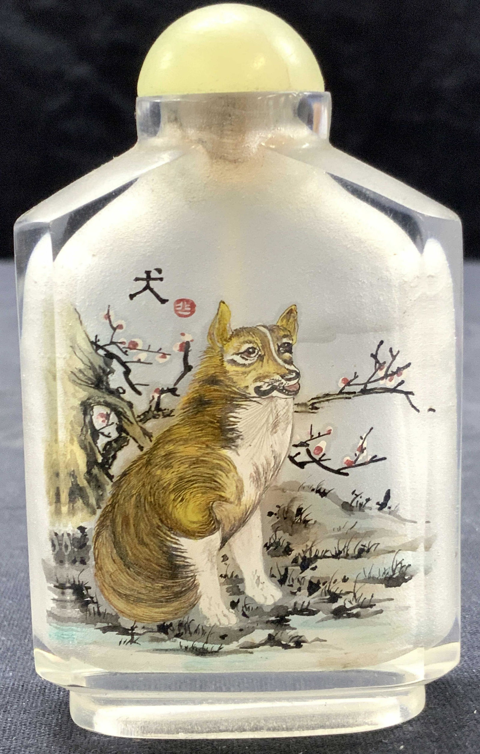 Vintage Asian Painted Snuff Bottle: Vintage Asian snuff bottle, weighted. Painted with a dog on one side and the other side has a depiction of a tiger. Cap is affixed to the bottle. Approximately 3.25 inches tall. Asian snuff bottle, gl
