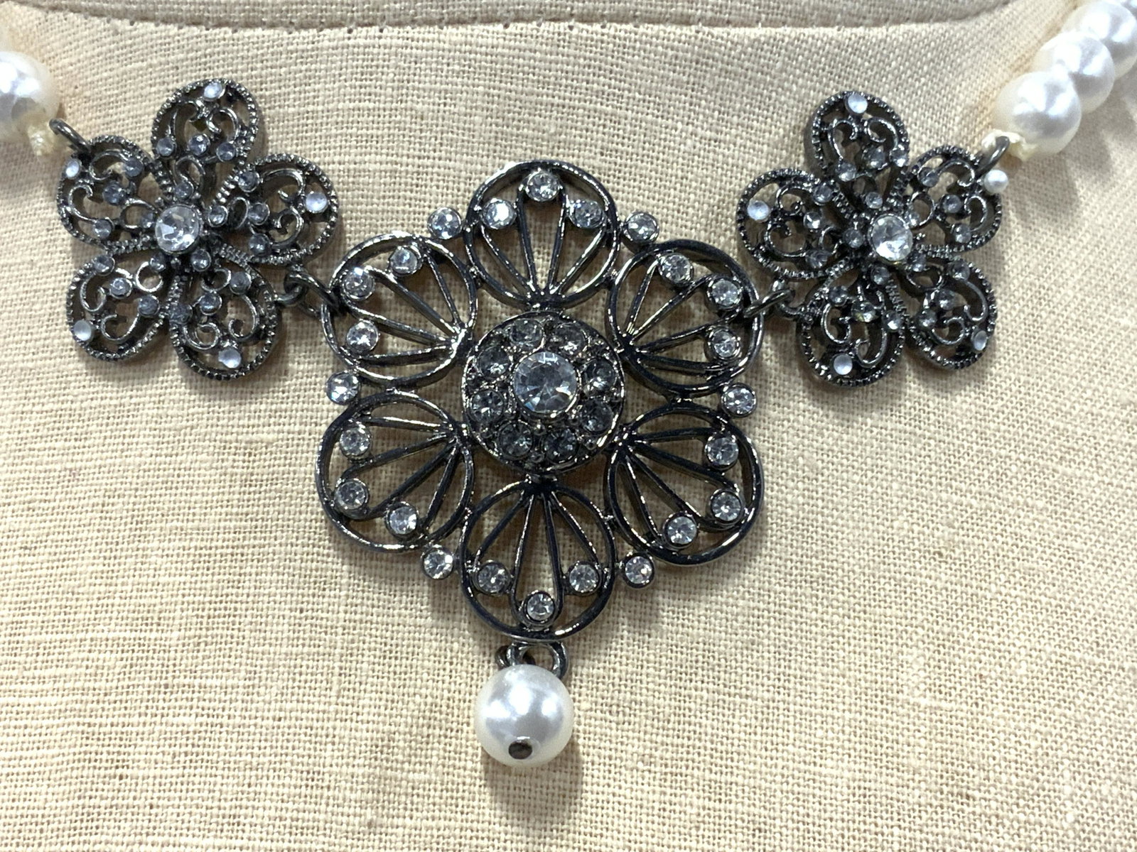 Pearlescent & Ornate Metal Work Necklace NWT: Pearlescent & Ornate Metal Work Necklace NWT, grey toned metal strand, grey toned metal work floral motif with bezel rhinestones, lobster claw clasp, adjustable length, length unknown. Pearlescent and