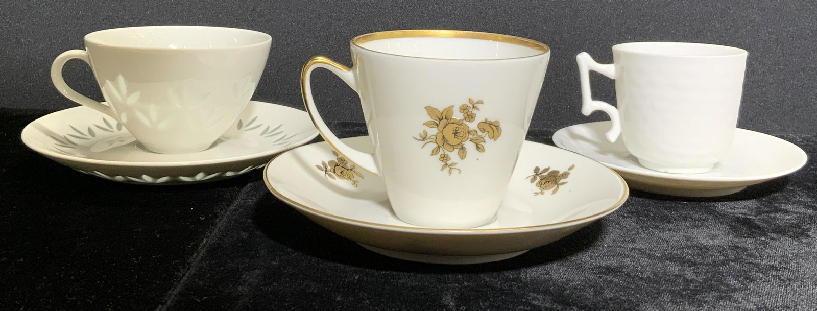 Lot 6 Trademarked Porcelain Cups & Saucers: Lot includes 3 cups & 3 saucers. 1 teacup and 1 saucer are inscribed ARABIA, 1 teacup and saucer is marked VA PORTUGAL, & 1 Teacup and saucer is marked POSGRUND NORWAY. Largest saucer measures approx 