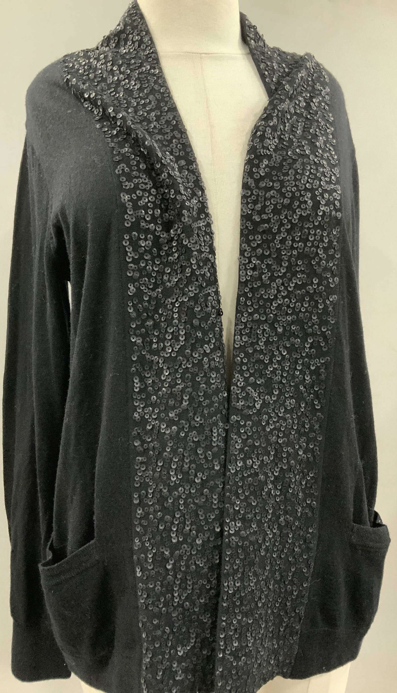 J. CREW Merino Wool Cardigan w Sequins, nwt: Black merino wool cardigan with flat black sequins along shawl collar ( flat meaning no iridescence) ladies size Large. 26 in. Long. Long sleeves, hand pocket. Original retail Tags attached, labeled D