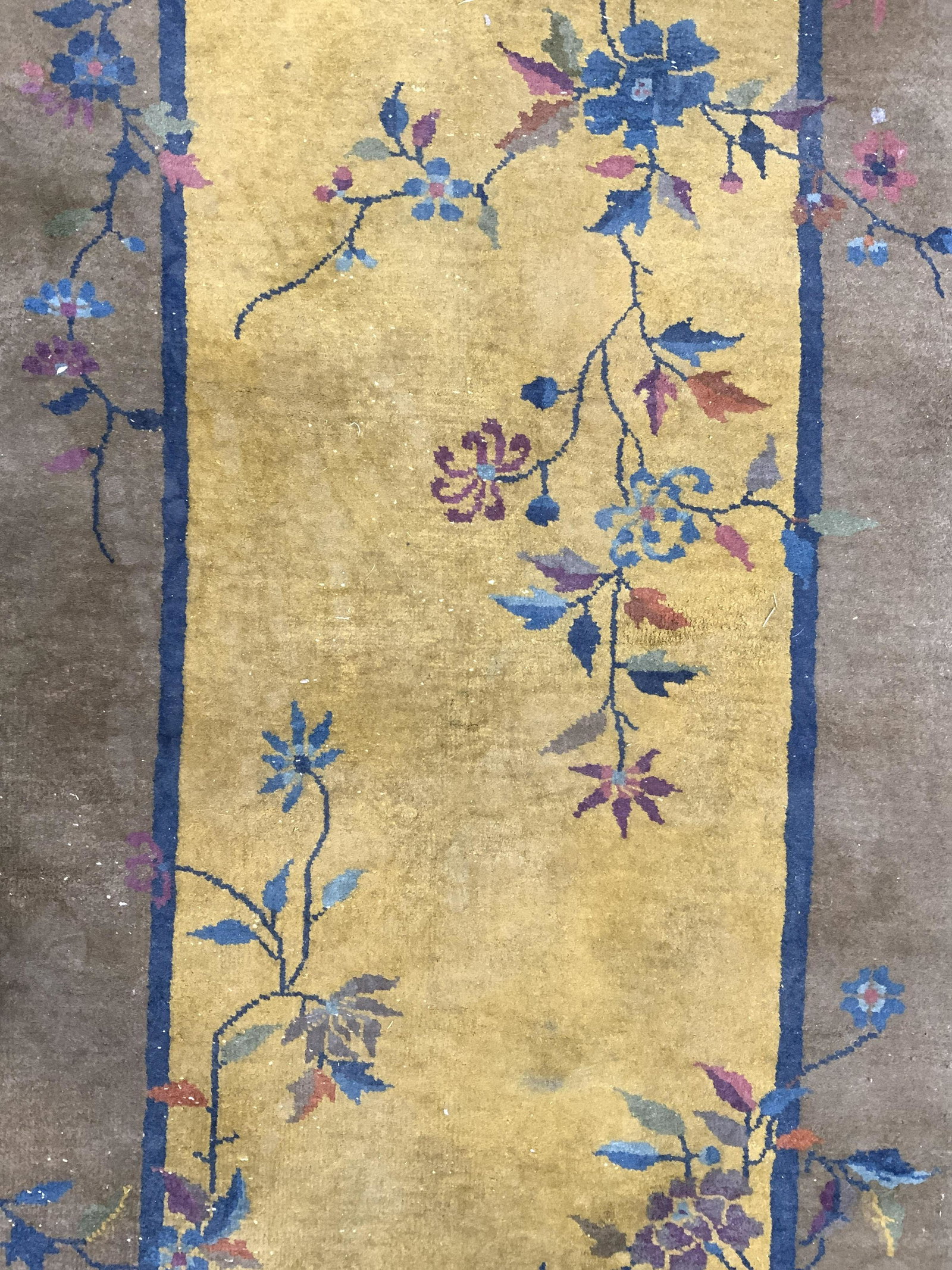 Vintage Handmade Chinese Art Deco Wool Rug: Rug is handmade and wool. Piece has intricate multi toned floral, vine, leaf & butterfly detail. Rug is vintage possibly antique. Piece measures approx 69 inches long 36 inches wide. Rug, carpet, wool