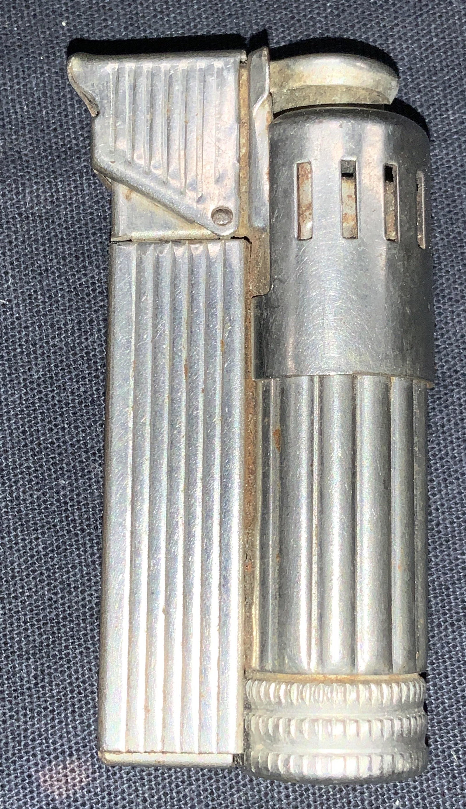 Vintage BOSS Butane Wick Lighter, Austria: Vintage white metal wick lighter. Removable bottom section for wick replacement, marked on side Patent BOSS U.S.Patent Flint Pierre Stein, Made in Austria. Approximately 2.25 inches tall. Not tested f