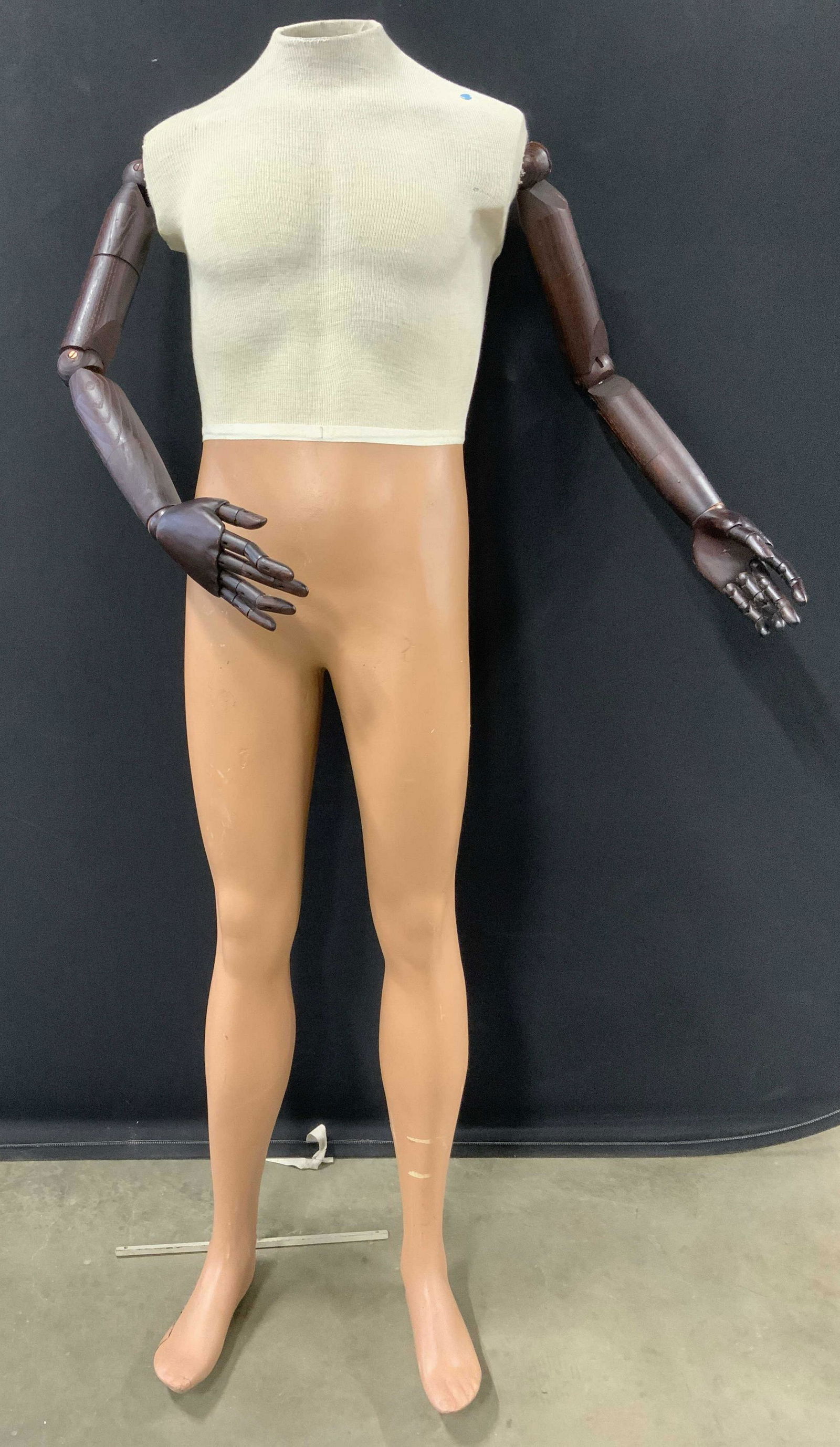 Vintage Articulated Headless Mannequin: Mannequin has articulated arms. Torso area of piece is lined with cream toned fabric. Mannequins has articulated arms and fingers which appear to possibly be wooden. Backside has metal support. Manneq