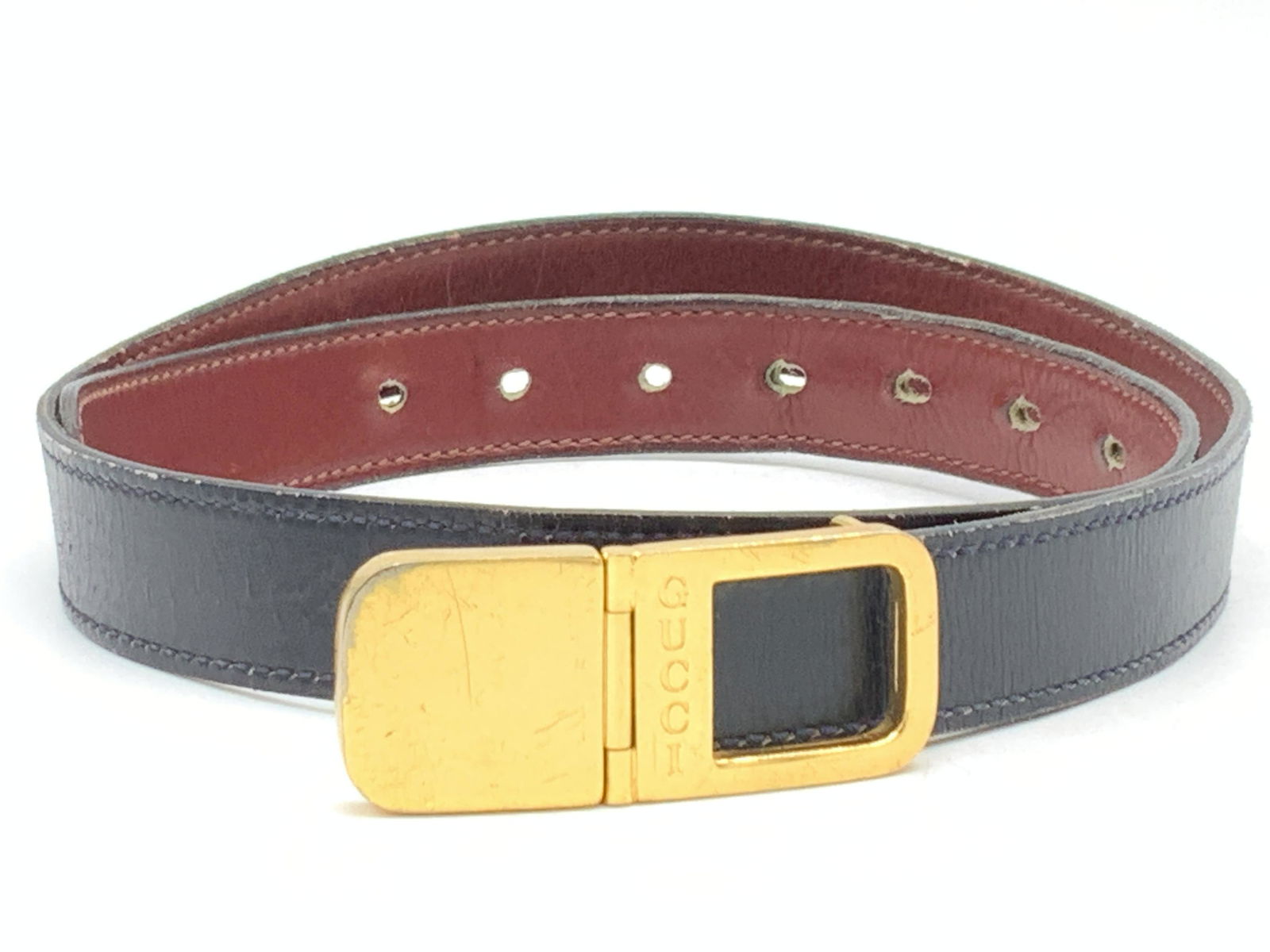 GUCCI Black Leather Fashion Belt, Italy: A black leather Gucci belt with underside of the band being a red tone. Buckle is gold toned and marked GUCCI and on side of buckle reads Gucci, Italy, Mod, Bev. Approximately 36 inches long. Minor we