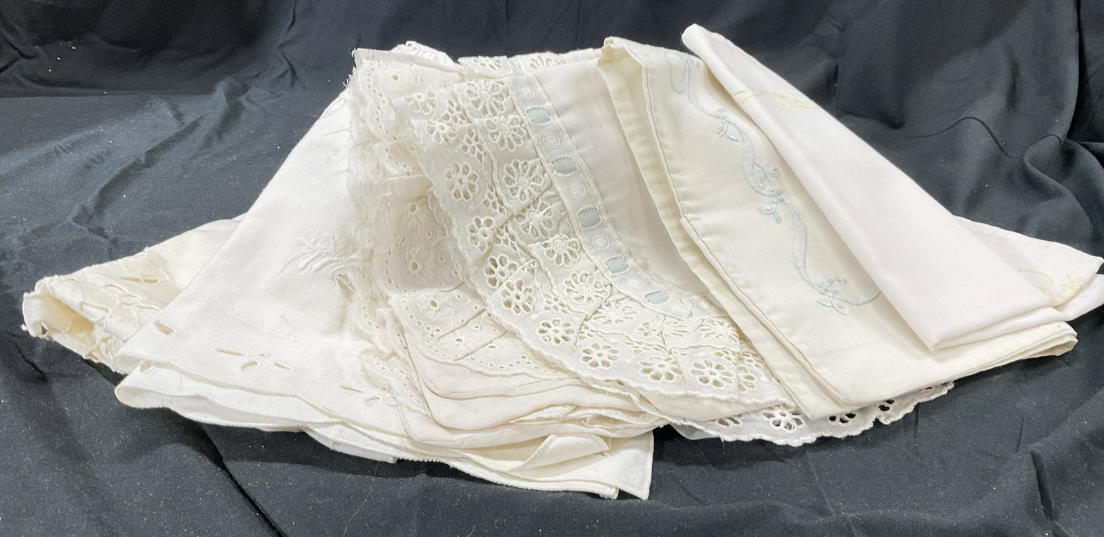 Lot 6 Vintage Linens, Pillow Shams: Lot 6 Vintage pillow shams. Some pieces have accents of embroidery in blue & yellow, other pieces have lace decor around and within piece. Each sham has a pocket for stuffing. Largest measures approx 