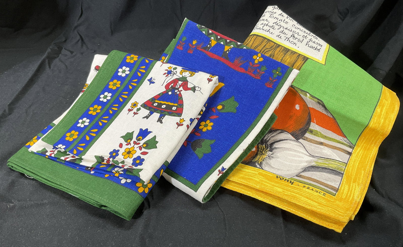 Lot 3 Cotton, Colorful Linens, France & Italy: Lot 3 Colorful Linens. Pressed linens. 1 marked France. 2 with people figures tagged with, Made in Italy 100% cotton. Largest measures approx 29 x 19 inches. Pieces are of multi different colors. Some