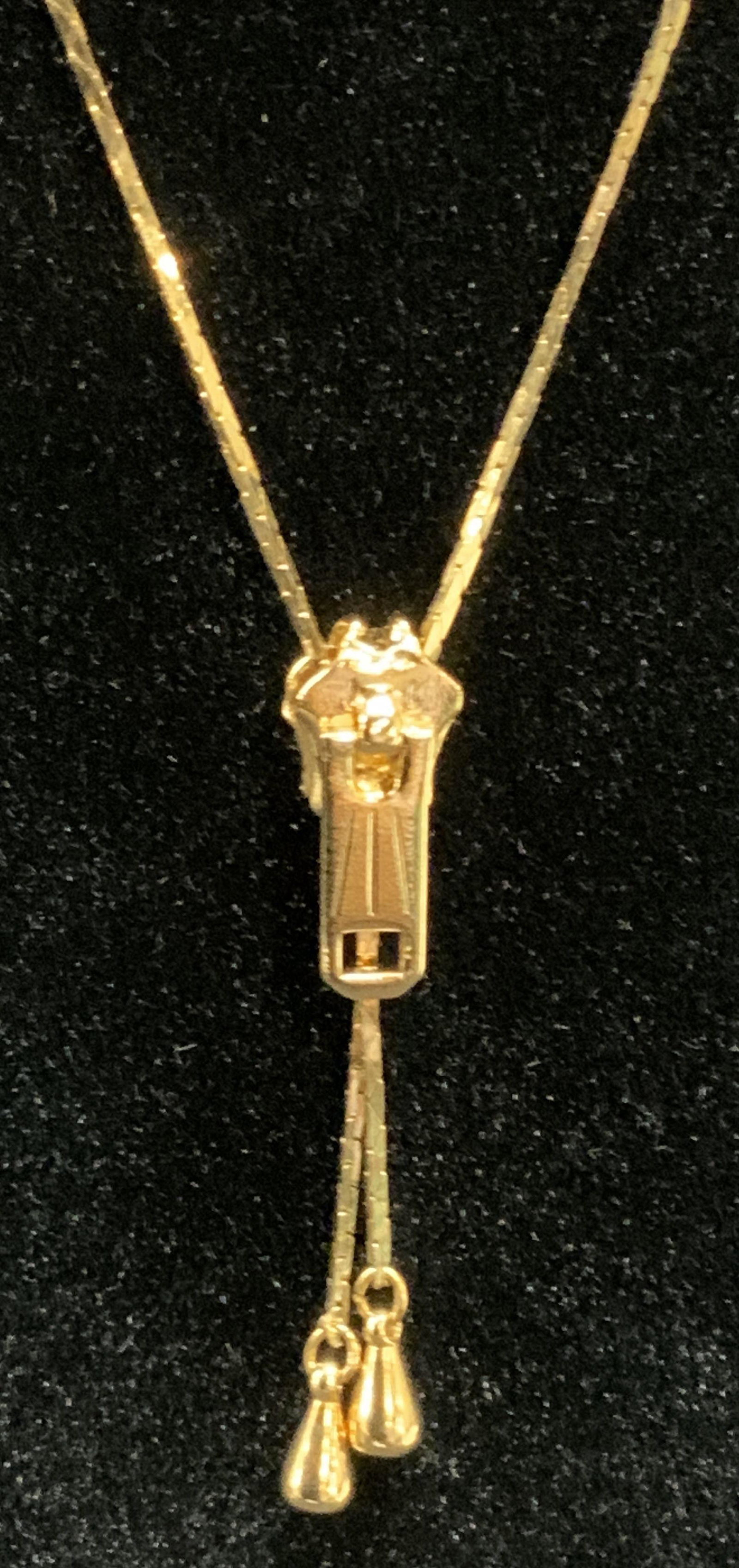 Vntg Gold Toned Zipper Necklace: Vntg Gold Toned Zipper Necklace, approx 28 inches long, zippers up for ideal placement of pendant. Property of Palm Beach, FL Estate. Chunky jewelry, statement Jewelry, vintage jewelry, contemporary j