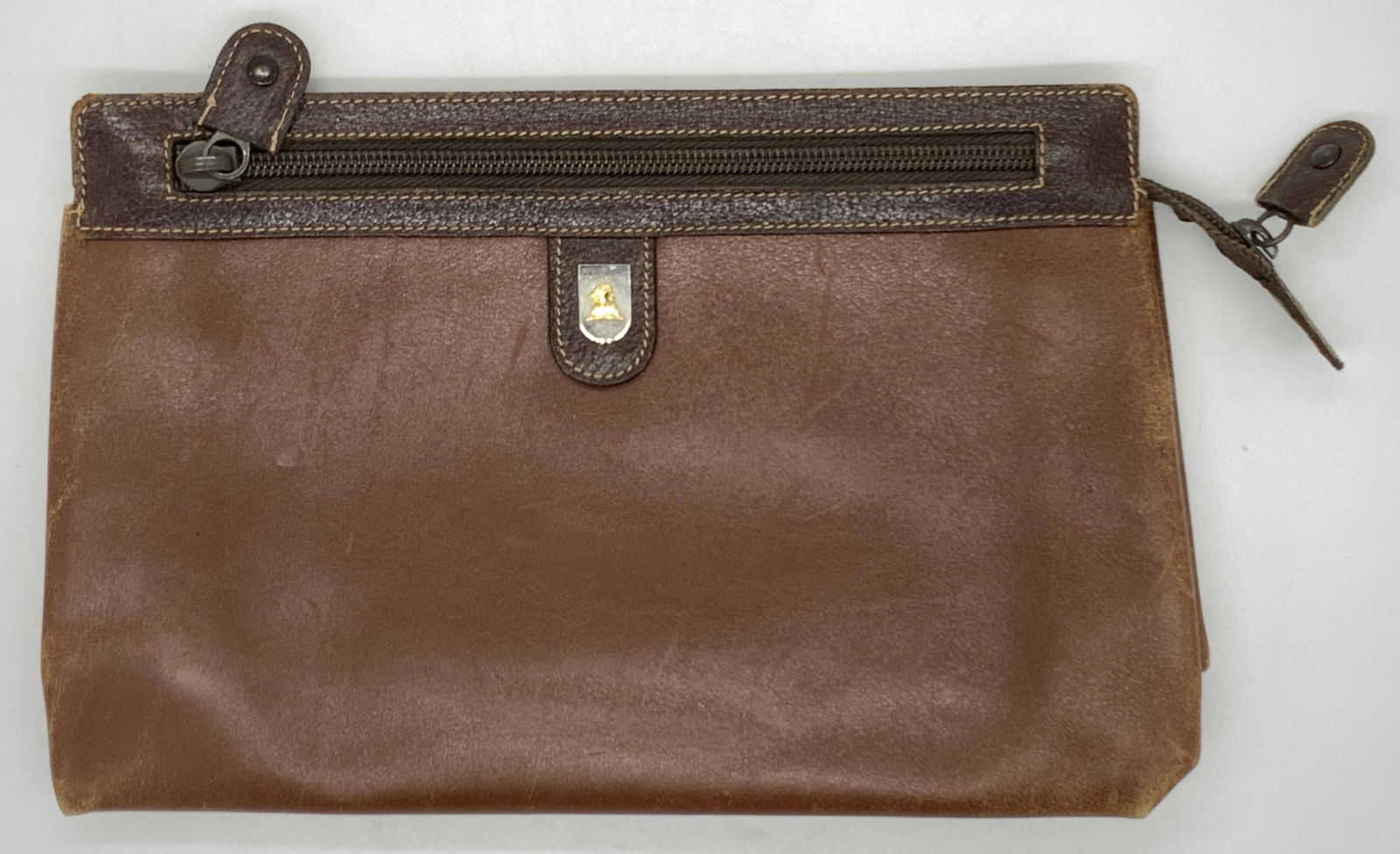 MARK CROSS Vintage Brown Leather Clutch, Italy: MARK CROSS Vintage Brown Leather Clutch, made in Italy, chestnut toned leather with chocolate toned leather top sequence, exterior wear consistent with age and use, top zipper closure, brown toned har