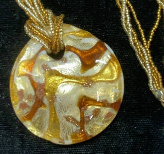 MURANO Glass Pendant Necklace, 14k clasp, NIB: Luxury 18 in. L Murano glass pendant with swirls of metallic amber and champagne colored glass. Pendant measures 1.75 in. Hand beaded with twisted beads. Clasp marked 14k. Original retail tag