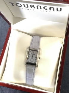 TOURNEAU MOP & Diamond Wristwatch in Org Box: Water Resistant 3 ATM Wristwatch, SIGNED TOURNEAU A4259 MOP 1064. MOTHER OF PEARL watch face with over 25 pave brilliant diamond, prong set and faceted. Lavender leather wrist band with croc pattern