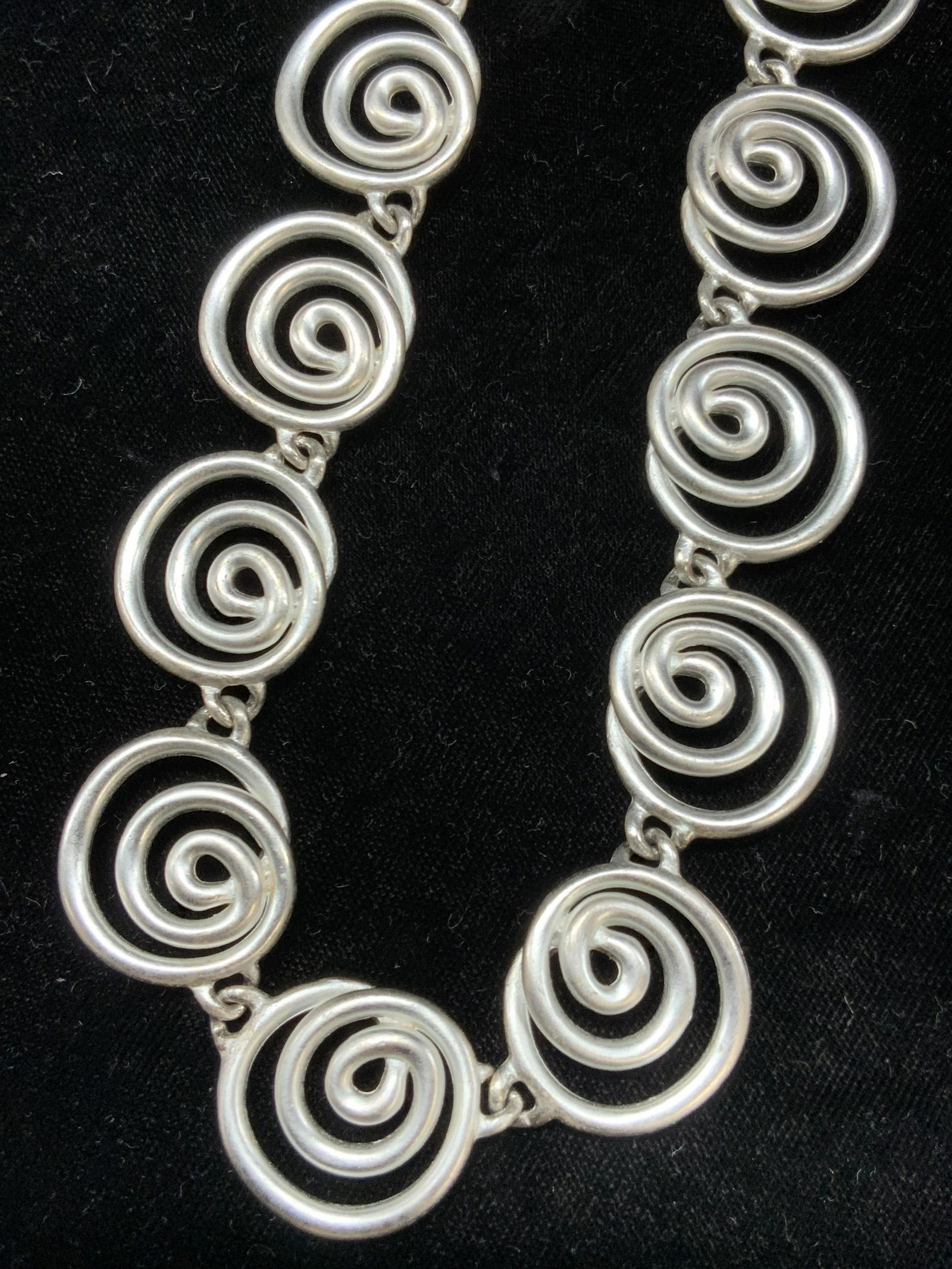 ANN KLEIN Signed Spiral Toggle Collar Necklace: Collar length necklace. Toggle clasp. Necklace is made up of spirals, marked Anne Klein on clasp. Approximately 17 inches long. Anne Klein accessories, Ann Klein necklace, Collar Necklace, Chunky jewe
