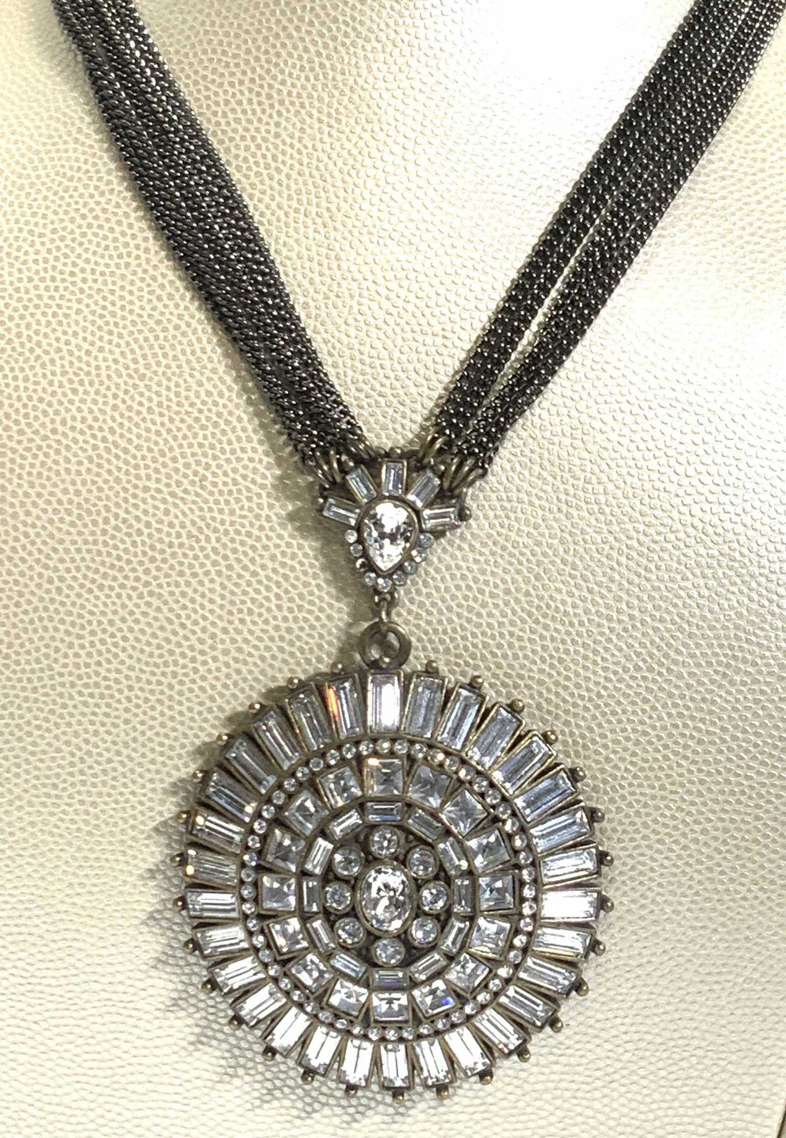 Badgley Mischka Couture Deco Pendant Necklace, NWT: Luxury brand cocktail necklace, multi flat curd chain in a dark gun metal. Signed Badgley Mischka on charm. Art Deco Crystal accents are at top of adjustable chain and accent the bail of the pendant. 