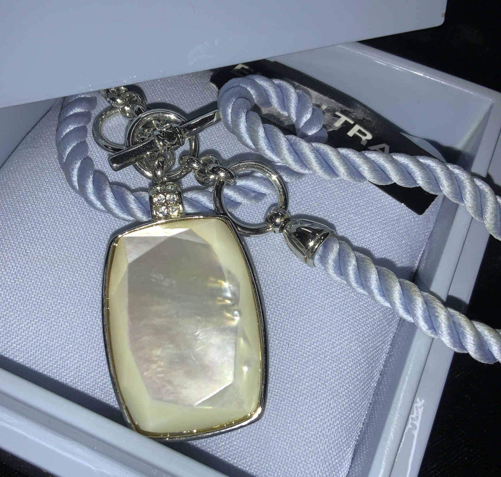 Ellen Tracy Sgn Mother of Pearl Pendant Neck, box: Vintage Ellen Tracy Cord necklace with mother of Pearl pendant bezel set in silver tone metal. original tag reads Mother of Pearl. This comes in blue box with a blue cushion insert ( tag attached here