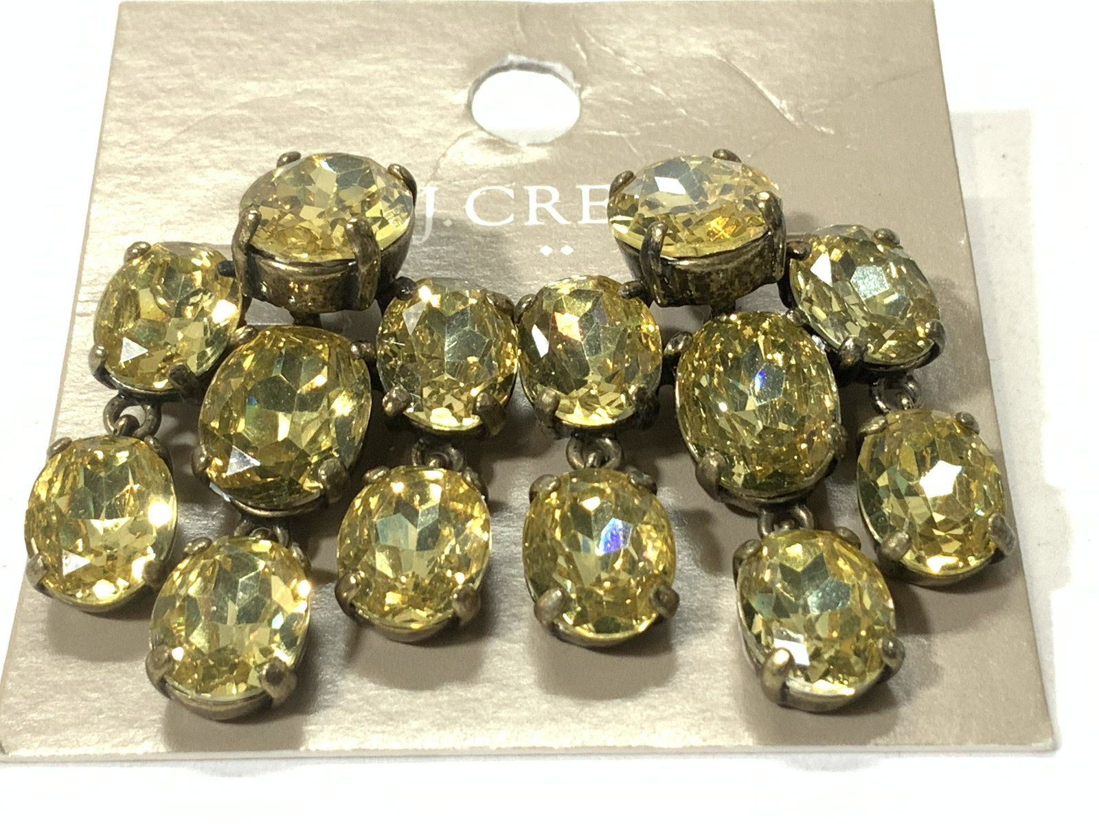 J. Crew Yellow Crystal Cocktail Earrings, NIP: Faceted Yellow Crystal drop earrings for pierced ears, post and disc backs, app 12 x 10 mm oval stones set in brass toned metal. Drop is 1.5 in. Width also 1 in. New on package. Statement jewelry, Est