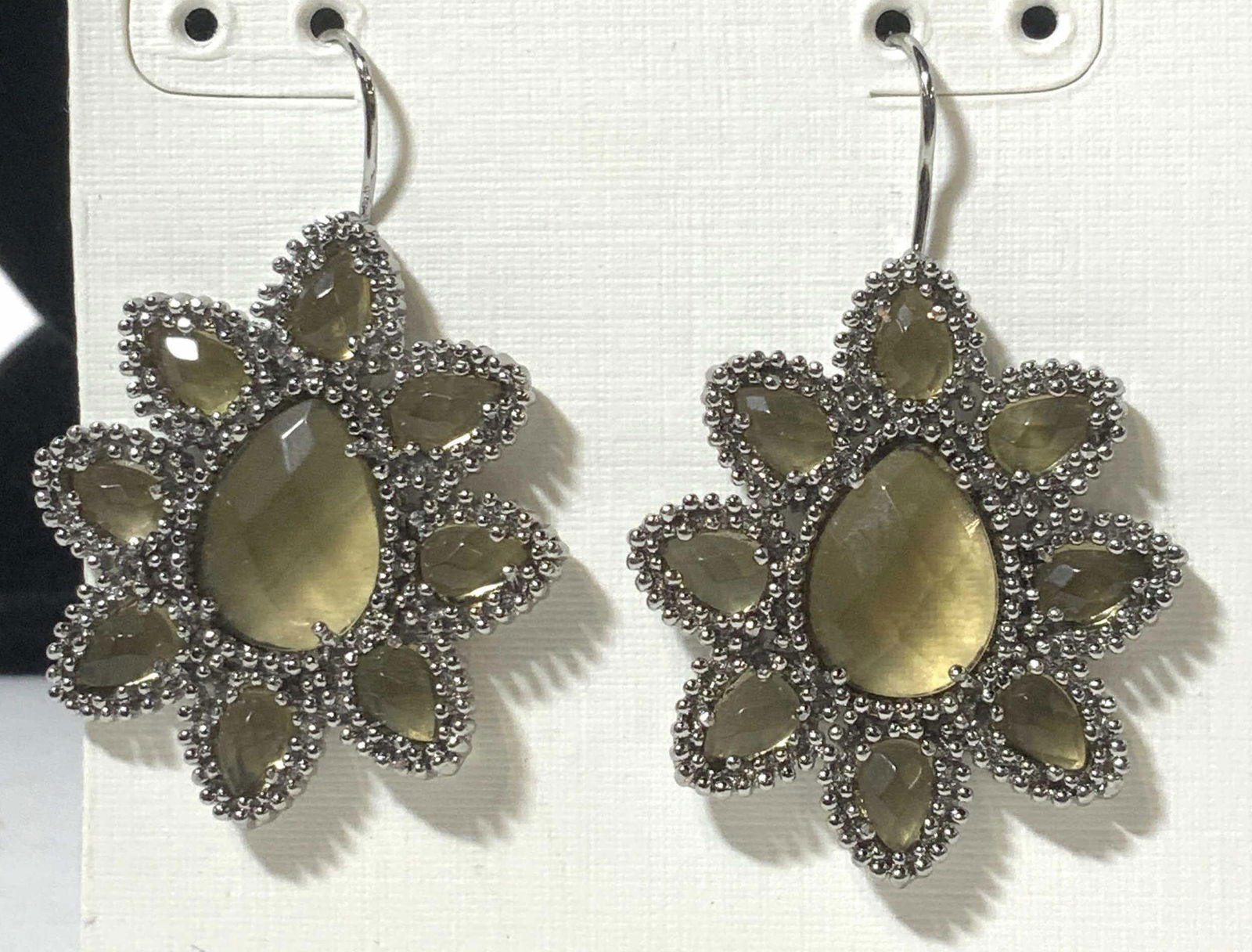 Kendra Scott Faceted Glass Flower Earrings, NIP: Silver toned drop earrings with embossed metal detail and faceted glass . Fish back hook earrings, for pierced ears, drop is 1.75 in. Flower earrings, Art glass jewelry, Signed Kendra Scott Earrings,