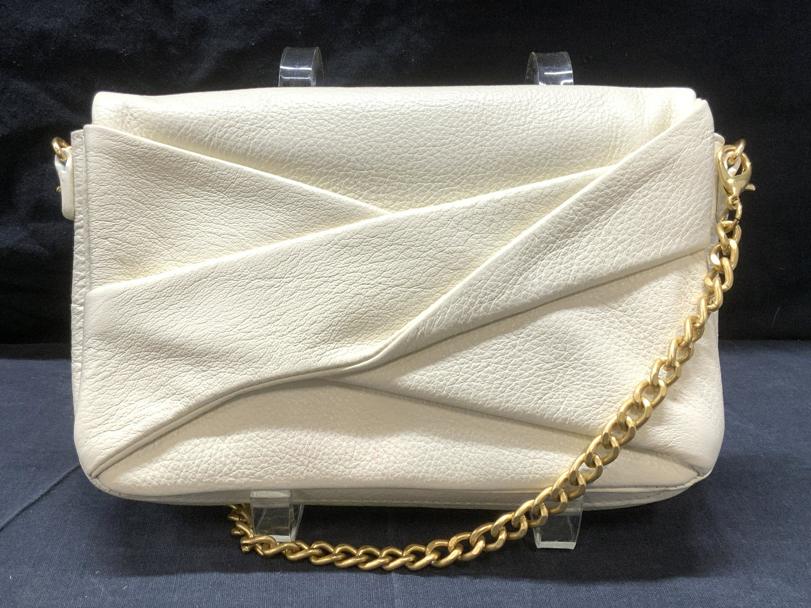 HALSTON HERITAGE White Leather Crossbody Purse: HALSTON HERITAGE White Pebble Leather Crossbody Purse, some minor blemishes to exterior leather, single flap magnetic closure, one exterior slip pocket, gold toned chain link strap can be detached to