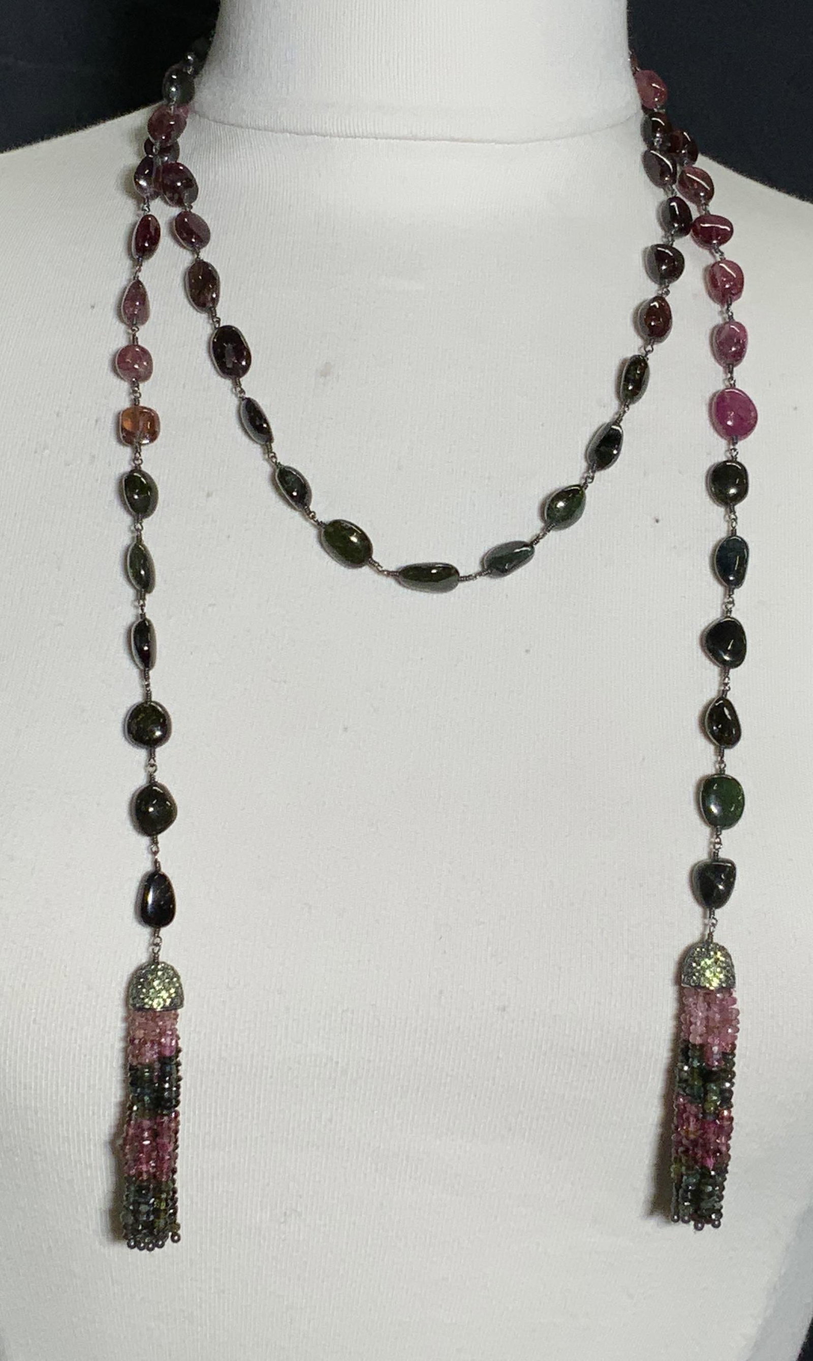 TOURMALINE Lariat Necklace, Semi Precious Stones: Tassel gemstone Lariat style necklace, a single strand 54 inches long. Wired by hand with meticulous care and attention. Polished red, green and pink tourmaline cabochons of varying hues. These beads 