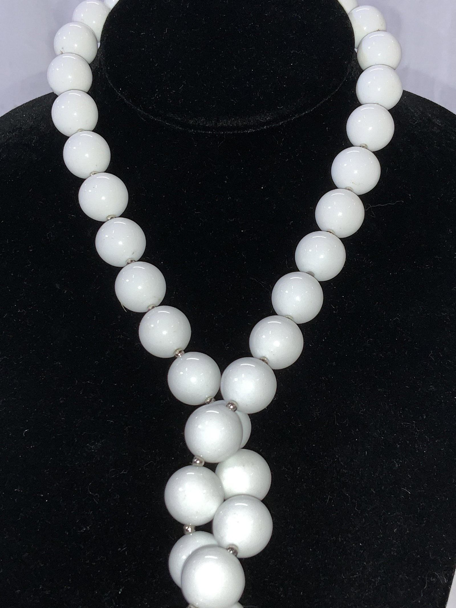 Mid Century Style Lightweight White Bead Necklace: 28 in. beaded necklace with uniform 1/2 in. round composite white beads alternating with silver tone seed beads. C spring clasp. Lightweight retro look. Necklace, white bead jewelry, handmade necklace