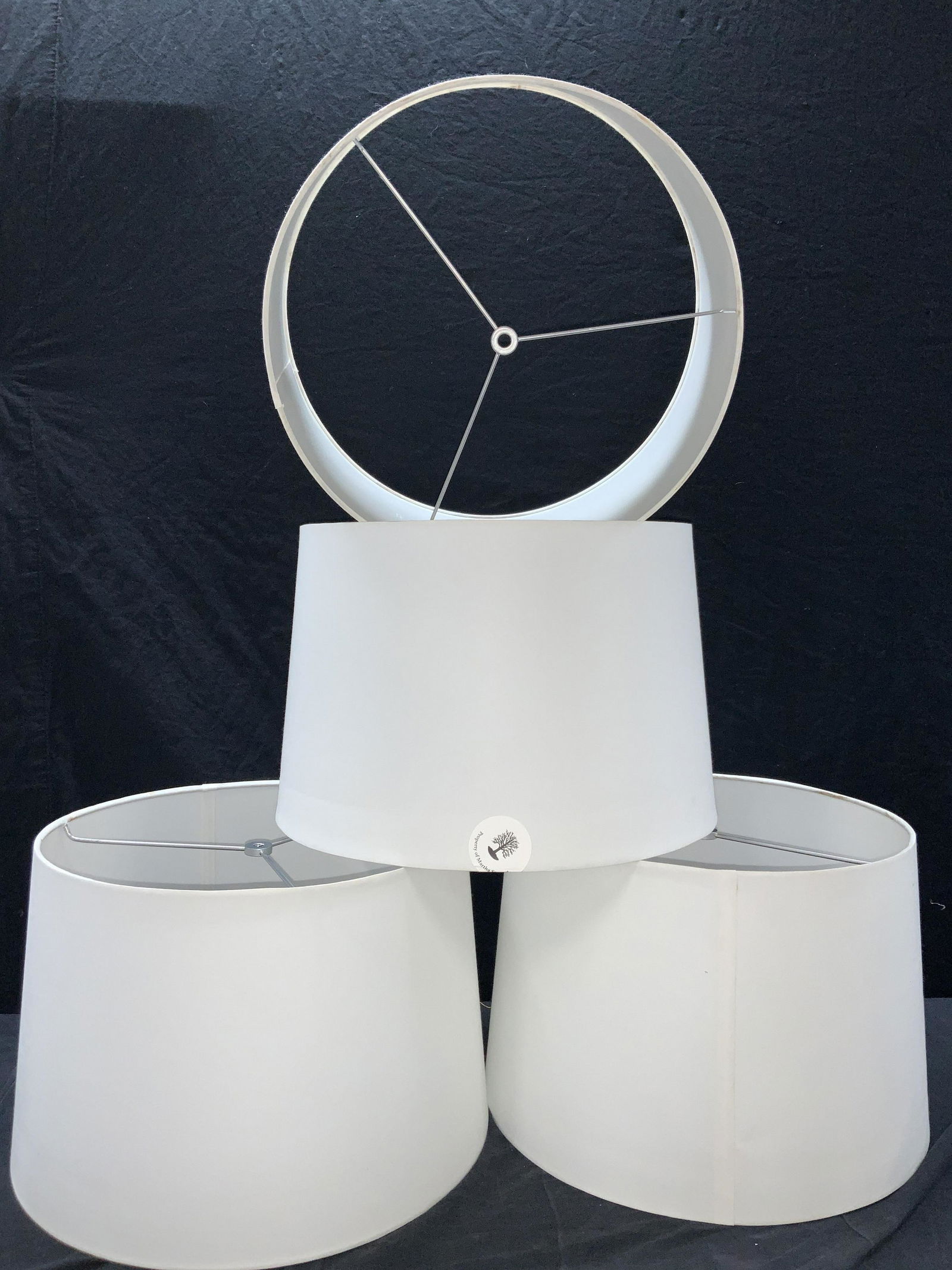 4 White Tapered Drum Lamp Shades: Group lot consisting of 4 off tapered drum lamp shapes. Approximately 11 inches tall and 15 inch diameter. Minor blemishes near top rims. Property of Martha Stewart Katonah, N.Y. Estate. Lamp shapes,