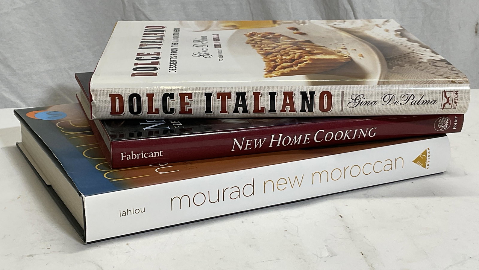 Lot 3 Cook Books: These three books include, DOLCE ITALIANO By Gina DePalma Copr. 2007, NEW HOME COOKING By Florence Fabricant Copr. 1991, MOURAD NEW MOROCCAN by Mourad Lahlou, Copr, 2011. These three books were part o