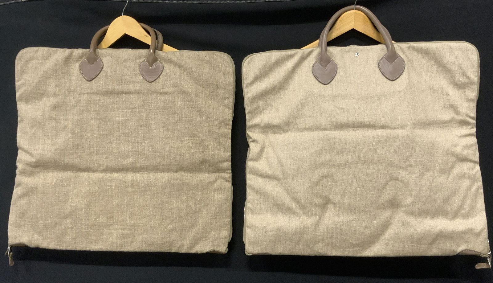 Pair Canvas & Leather Garment Bags: Pair Canvas & Leather Garment Bags, beige & light brown with dual top handles, can be folded and zipped to half-length for travel convenience, canvas lined interior, interior has 1 full length zipper