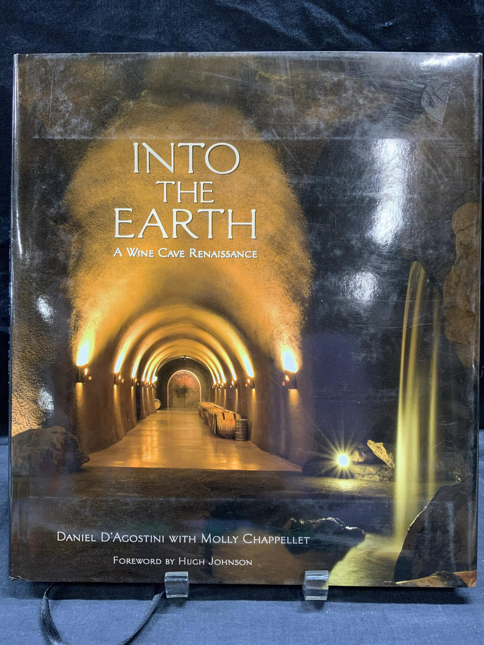 Into The Earth: A Wine Cave Renaissance Hard Cover: Into The Earth: A Wine Cave Renaissance Hard Cover By Daniel DAgostini with Molly Chappellet, foreword by Hugh Johnson, published by Panache Partners, copyright 2009, measures 11 x 12 1/4 inches, incl