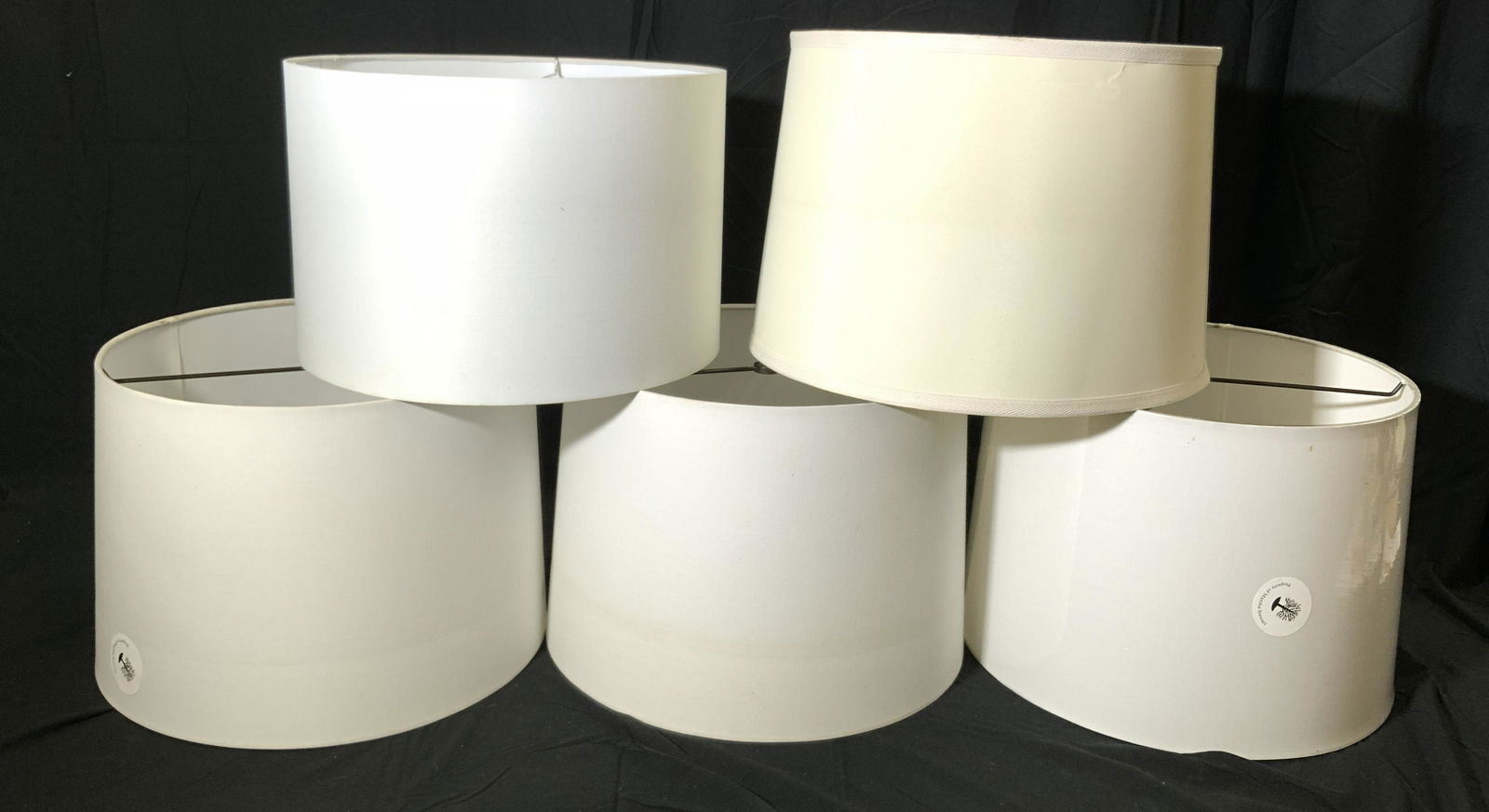 Lot 5 White & Cream Drum Lampshades: Assorted group of white and cream colored lampshades. Three lampshades in white fabric, measure approx. 11.25 inches tall, 14.75 inches diameter each. One lampshade in cream fabric, measures approx. 1
