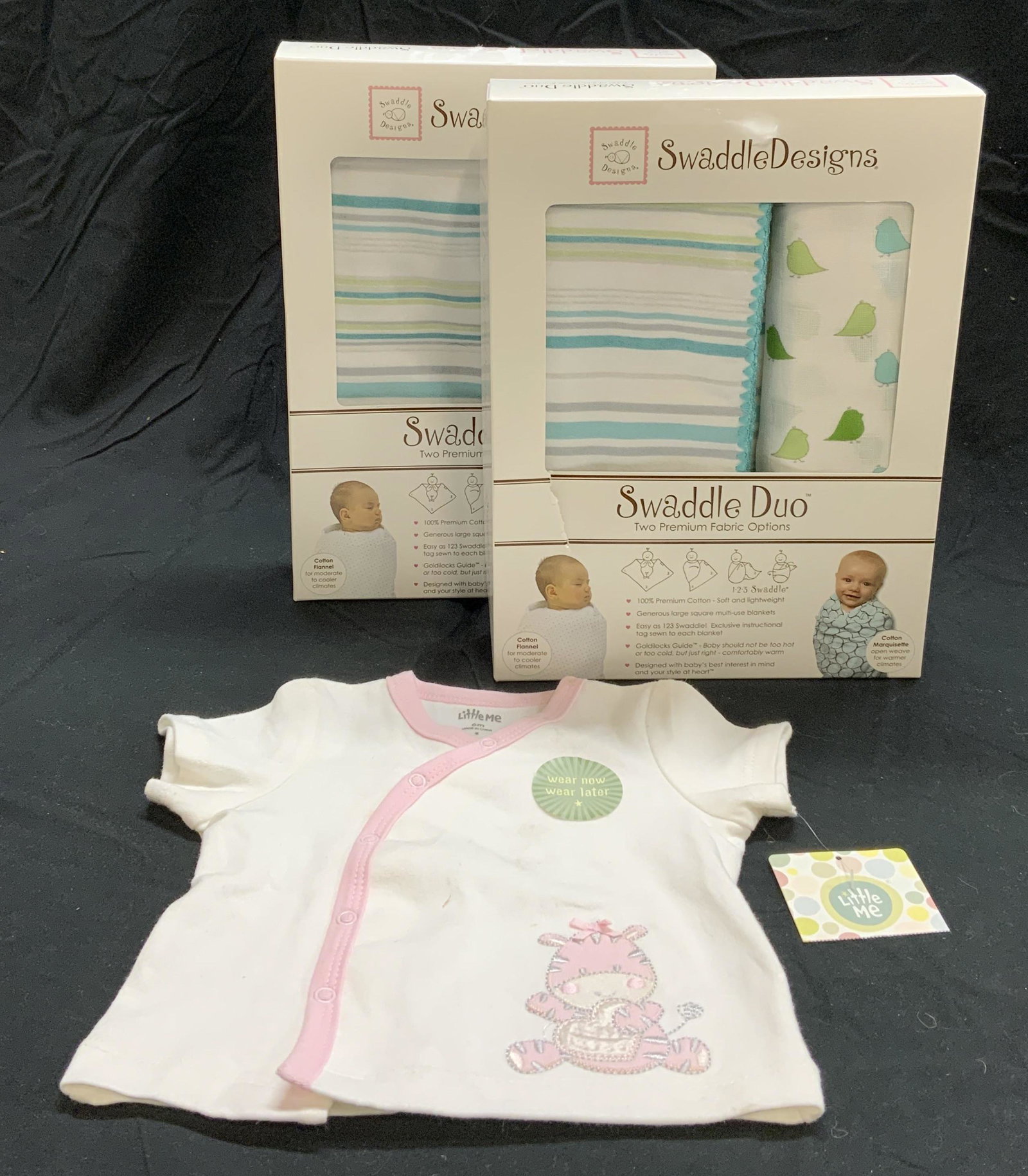 Lot 3 SWADDLE DESIGNS Swaddling Blankets, More: Two SWADDLE DESIGNS swaddling blanket duos, 100% cotton, one cotton flannel and one cotton marquisette blanket. Blankets measure 42 x 42 inches and 46 x 46 inches. New in original packaging, not inspe