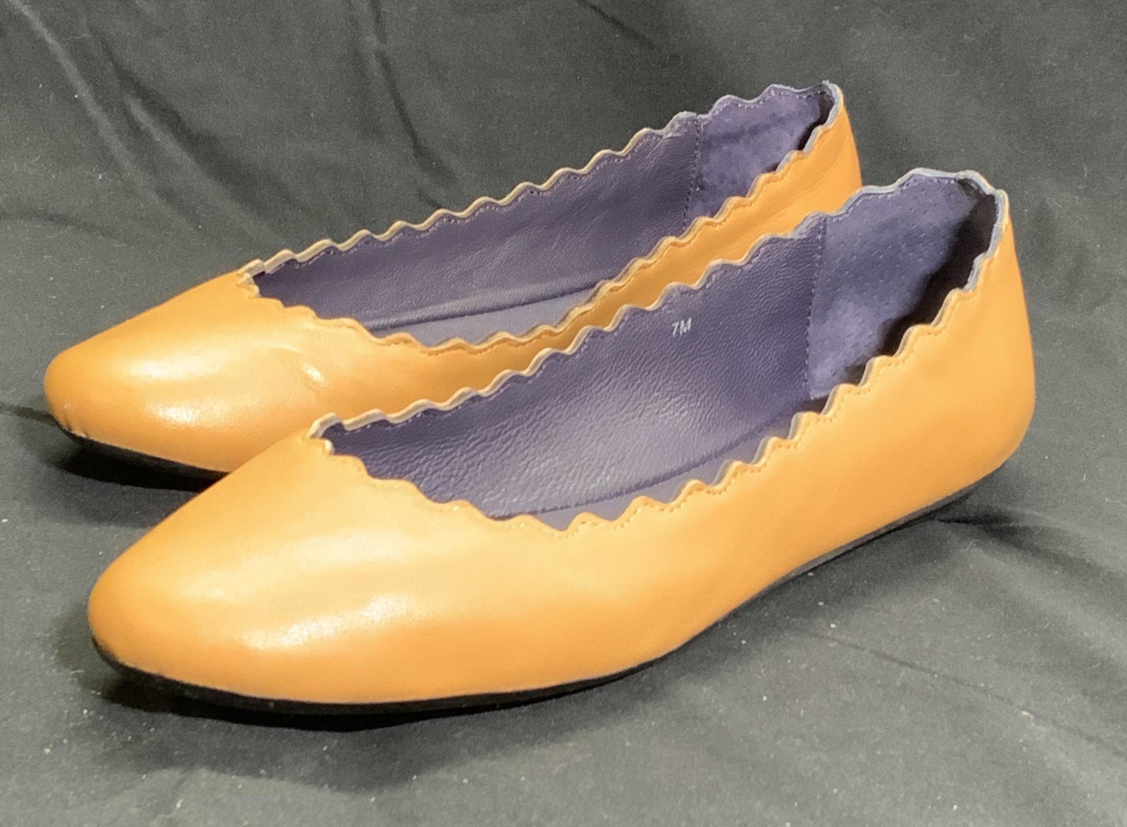VANELI Scalloped Tan Leather Ballet Flats: Gently worn VANELI Ballet flats in soft hand tan leather with scalloped edge detail. Some creasing to outer body, minor scuffing on heels. Marked size 7M on interior. VANELI, VANELI flats, ballet flat