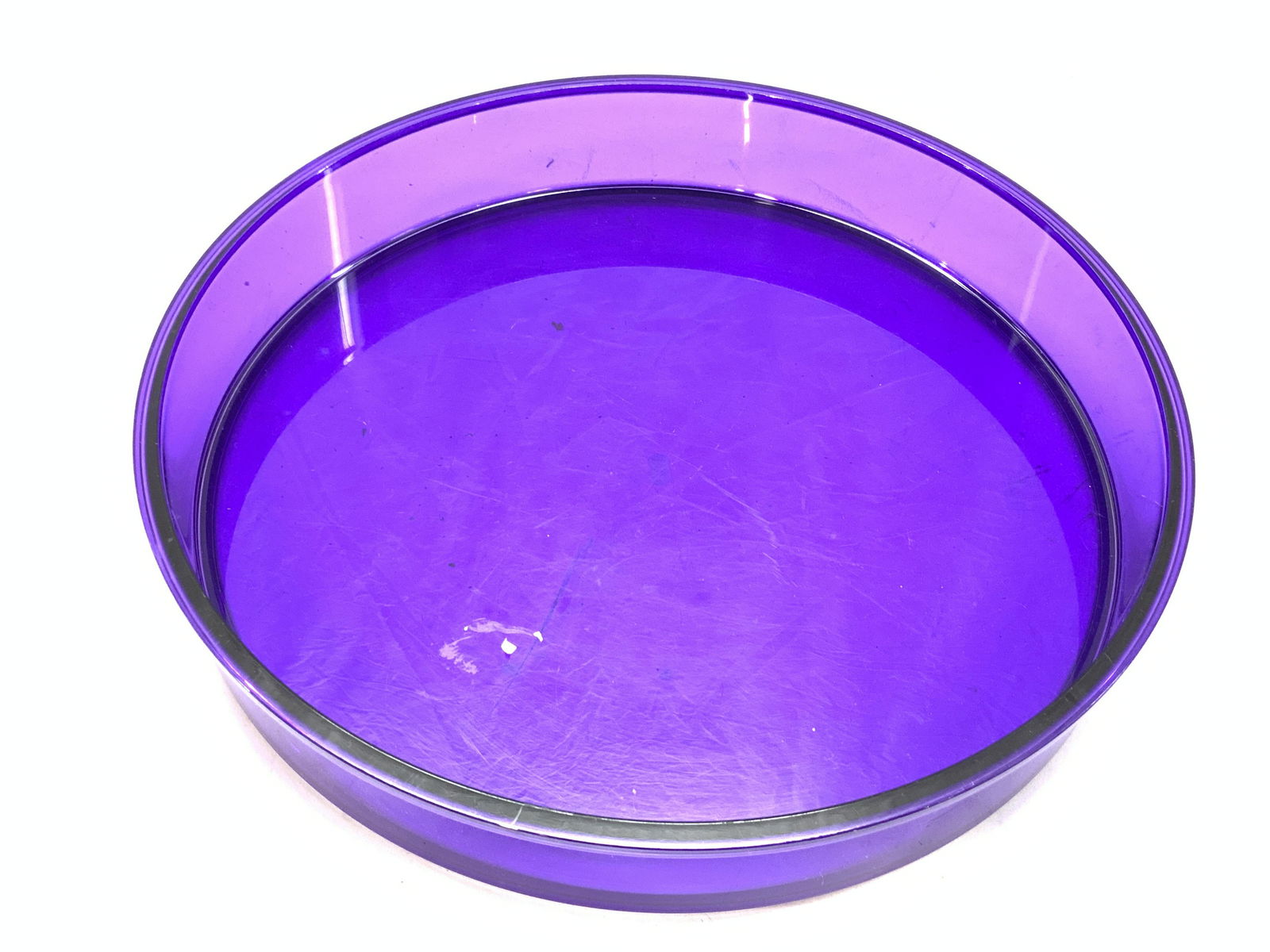 DANSK DESIGNS Composite Centerpiece Tray: A composite made purple toned tray. Marked on underside DANSK Designs GC Denmark. Approximately 13.5 inches wide and 2.25 inches tall. Minor wearing to tray. Centerpiece tray, tabletop tray, tray, pur