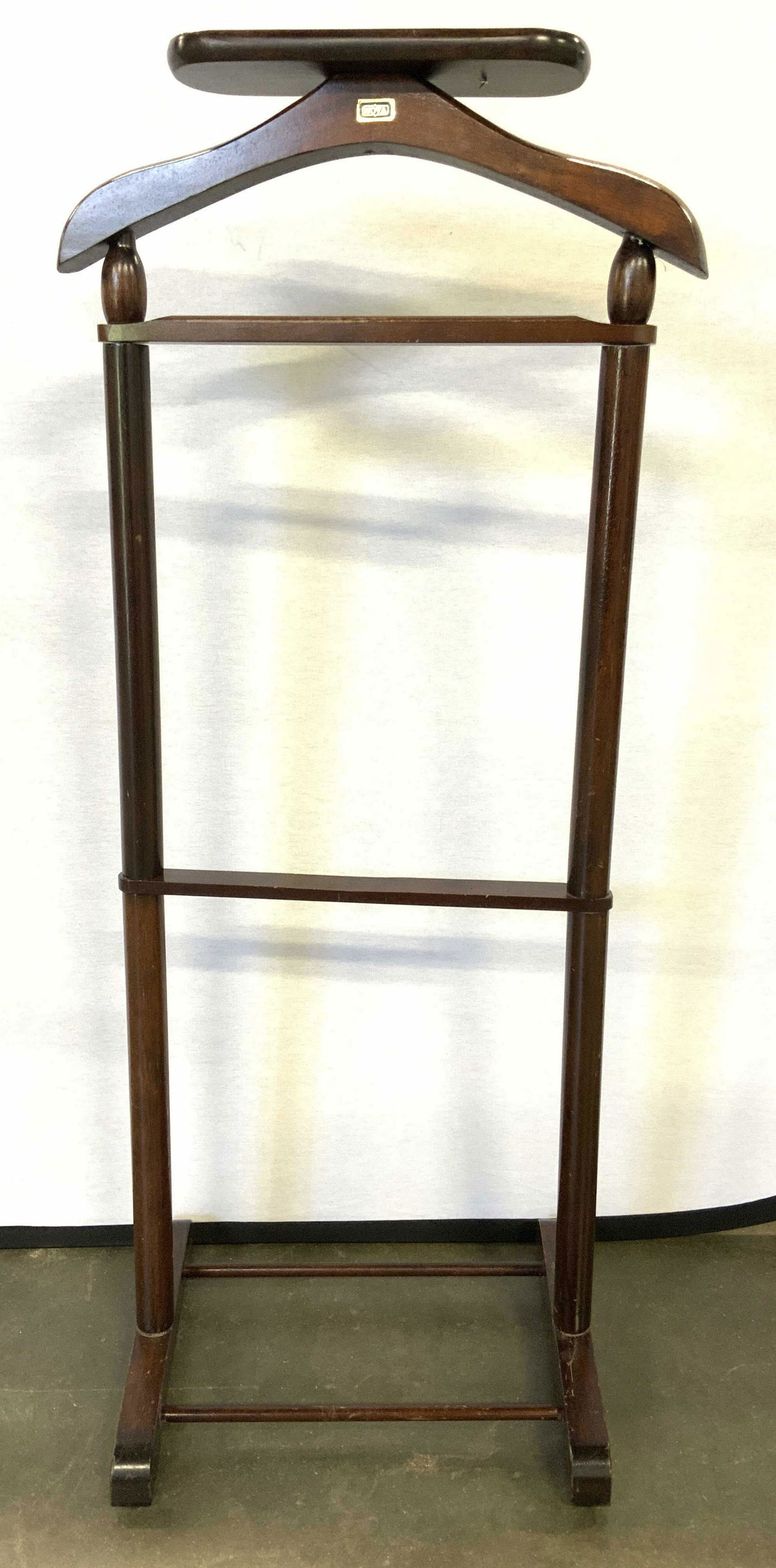 NOVA Vintage Carved Wooden Valet Stand: Valet stand has tag which reads NOVA. Piece is brown toned and wooden. Valet stand measures approx 45 inches tall 19 inches wide 13 inches deep. Valet stand, wooden valet stand, Nova valet stand, home